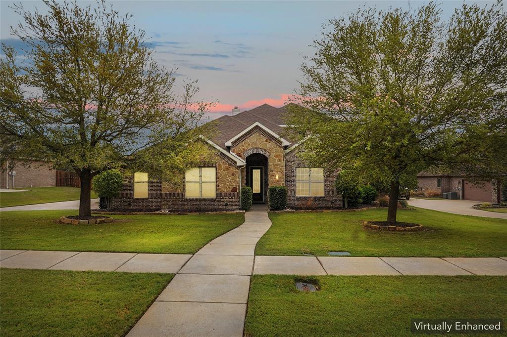 Tucked away on nearly half an acre in the sought after Ovilla Parc neighborhood, this exceptionally maintained custom John Houston home is perfectly designed for a family looking to step up into a larger, more accommodating space. The expansive, light filled layout effortlessly caters to busy family life, anchored by an oversized living area that flows seamlessly into the kitchen for daily gathering. The intelligent floor plan features four bedrooms plus a dedicated flex room ideal for a home office. Convenience is optimized throughout, from massive closets in every room to the oversized utility room with an integrated storage room connecting directly to the spacious primary closet.

The main floor offers a private, relaxing primary suite alongside a separate guest or mother in law suite with a private bath. Upstairs, the layout continues to impress with a generous game room, two additional bedrooms, & a full bath, giving children or teens a dedicated zone of their own. Energy efficient features like a radiant barrier, vinyl windows, & blown fiberglass insulation ensure year round comfort across this impressive footprint.

The interior living spaces transition beautifully to a spectacular backyard oasis framed by mature trees, lush greenery, & a sprinkler system to keep the lawn pristine. Families will fall in love with the sparkling, fully fenced saltwater pool, complete with a calming water feature creating a true resort feel. Beyond the secure pool area lies a massive, open lawn with ample space for children, pets, & outdoor play. Adding to the incredible utility of this property is a standard two car garage paired with a separate, rear facing third garage featuring a drive around entry & pristine epoxy flooring ideal for a workshop, boat storage, or an extra vehicle. This property is a rare find combining space, functionality, & an unmatched neighborhood lifestyle. Ask for the Youtube video & 3D Tour!