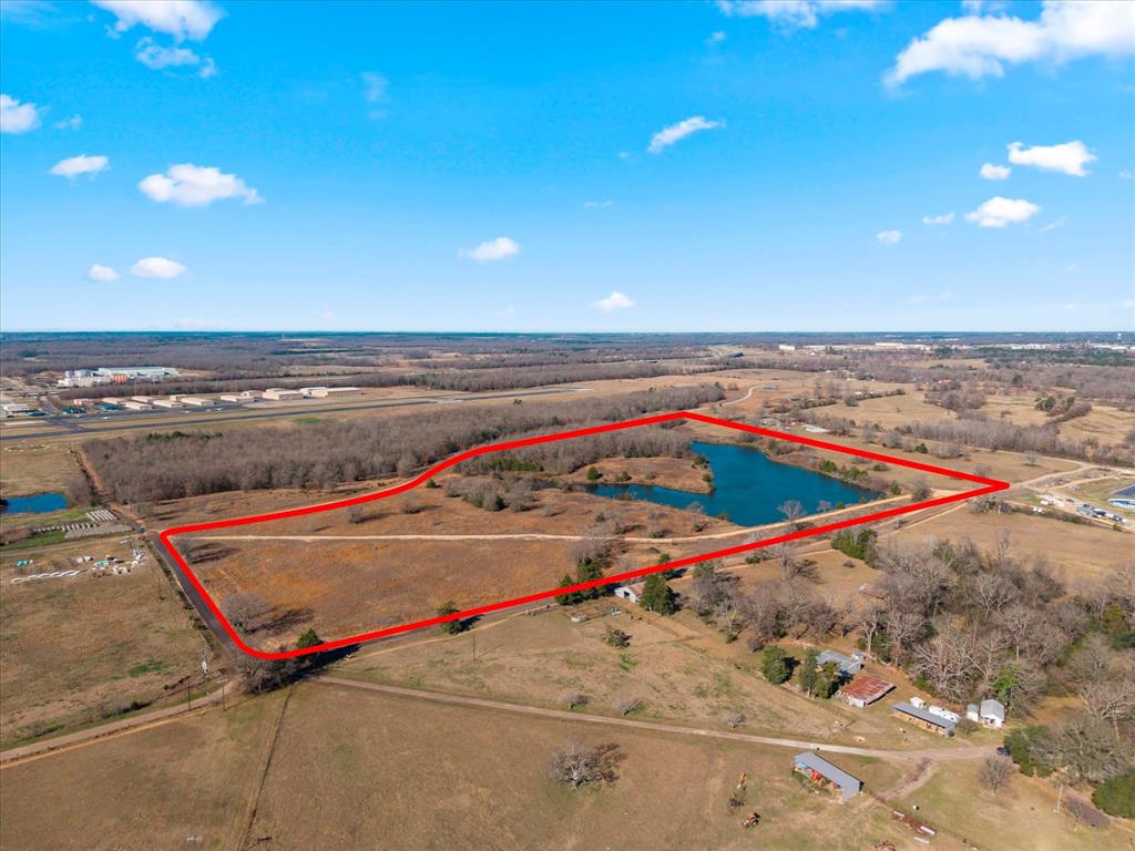 ROLLING PASTURE LAND WITH A LARGE POND.  CONVENIENTLY LOCATED JUST OFF US 271, NEAR AIRPORT AND CLOSE TO SHOPPING.