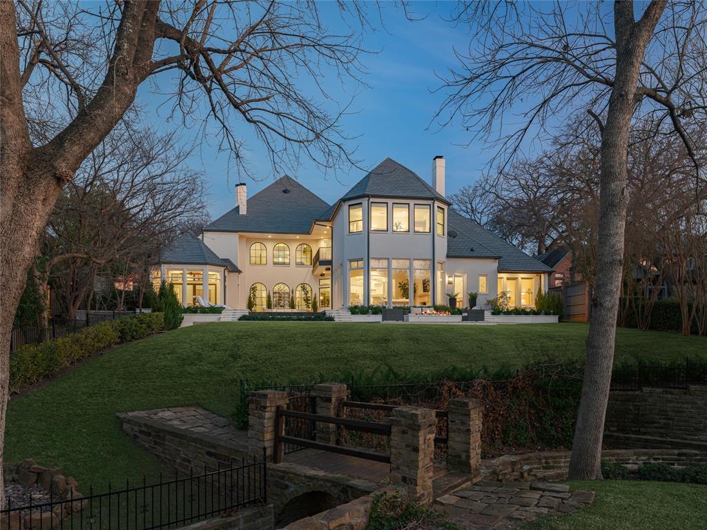 Nestled in a picturesque setting, the 9,705 square foot home at 17711 Cedar Creek Canyon Drive is a masterpiece of architectural elegance and thoughtful design. As you step inside this exceptional home, you are immediately greeted by a sense of openness and sophistication. The expansive layout seamlessly integrates both comfort and functionality, making every corner of this home an inviting space. High ceilings and large windows ensure that these spaces are flooded with natural light.
The focal point is undoubtedly the stunning infinity pool that seamlessly merges with the picturesque views of the adjacent creek. This idyllic setting transforms every space of this heavenly retreat, where the water appears to spill endlessly into the captivating landscapes beyond, blurring the line between human and nature-made beauty.
The heart of the home boasts two impressive living areas, a dining room, and a gourmet kitchen equipped with modern appliances, ample storage, and a large island, perfect for entertaining and family gatherings. The residence features six generously sized bedrooms, each designed to offer a personal sanctuary with their own unique charm. The incorporation of a state-of-the-art theater provides an unparalleled entertainment venue, perfect for movie nights as well as a game room with beverage area.
Keeping wellness at the forefront, the property has been updated to include a luxurious sauna complemented by a cold plunge. These additions not only provide practical health benefits but also amplify the home’s spa-like aura, offering a perfect place to unwind and rejuvenate. Together, these thoughtfully curated amenities make this home a sanctuary of modern luxury, seamlessly blending elegance with functionality.