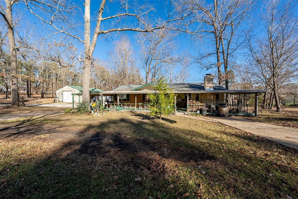 Come check out this cozy lakefront home nestled on a 1.37-acre lot with waterfront views of Glenwood Acres West Lake. Enjoy the peaceful tranquility from the inviting wraparound front porch, or relax on the expansive screened-in back porch, perfect for enjoying the peaceful estate-sized yard and shimmering lake. A charming wood deck with a gazebo creates an idyllic retreat for enjoying your gorgeous lake views. This cozy yet spacious home offers two bedrooms, a recently renovated bathroom, and an additional versatile living-bonus area, providing ample space for comfort or leisure. Whether you’re seeking a full-time residence or a peaceful getaway, this home is the perfect haven. For the hobbyist or outdoor enthusiast, the large, insulated 30x40 custom-built shop with attached covered RV parking is an added bonus. Don’t miss out on the opportunity to experience this exceptional property—schedule a visit today!