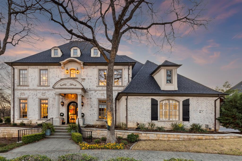 Strategically situated on a large corner lot just a stone's throw away from the guard gated entrance to Hogans Glen sits 1 Hayes CT. This beautiful French inspired chateau is truly one of a kind! Stunning views in all directions! Look for lovely stone bridges, ponds with fountains nestled against the backdrop of the Hogans Glen Golf Course, amazing oak trees, and of course the Resident Geese! This house has been thoughtfully renovated. Since the home's strong bones and architectural detail were already present, much consideration was given to just simply re-creating its original beauty in a more current fashion to make her a grand lady once again!  The circular cobblestone driveway leads to a stunning arched entry door, elegantly crafted with custom made iron and glass. Upon entering, guests are greeted by an impressive iron circular staircase, slate floors and a high end glass & chrome sputnik chandelier. The dining room, now an elegant piano room, is bathed in natural light from the multiple custom windows. The kitchen boasts every amenity desired for hosting the perfect dinner party, including high-end appliances, a pot filler, warming drawers, under counter refrigerator and a wine cellar. The secluded primary suite offers patio access and features a spacious walk-in shower, dual vanities, a whirlpool tub, and his-and-hers custom closets. Upstairs, is a sprawling game room, a stadium-style media room, and a balcony overlooking the pool. This home is absolutely stunning—a true must-see!