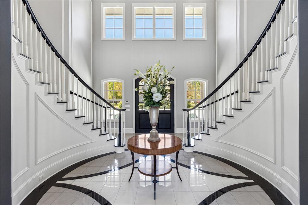 Introducing a beautiful estate home nestled in Tyler, TX that effortlessly combines luxury with convenience and functionality. This 6-bedroom home with 5 ensuite bedrooms, has a total of 7 full baths, including a handicap-accessible bath, and 2 half baths. It houses a 4-car garage and is punctuated with high-end updates such as new roof, gutters, and pool improvements. An ethereal foyer unveils a dual staircase adorned with a unique groin ceiling, leading to formal living and dining areas featuring a majestic two-story coffered ceiling and a cast stone gas fireplace. The first floor accommodates a master suite, opening out to a covered patio, two deluxe closets, and a spa-like bath, complete with Carrera marble heated flooring. A downstairs guest room offers its own privacy with a handicap-friendly bathroom. State-of-art features extend into the home office, laundry room equipped with dual washers dryers, and a laundry chute with dumbwaiter and a craft room with 4 desk areas, sink and storage closet. The chef’s kitchen is a dream with top-of-line appliances, a walk-in pantry, alongside a butler’s pantry. The family room and bar area come fully equipped and make it an entertainment nirvana. Upstairs, you'll discover three additional bedrooms, each with ensuite bathrooms, walk-in closets, and ample storage. Rounding out this impressive space is a media room complete with full amenities, a playroom with built-in features and additional space that could be a bedroom, bunk room or bonus room. The estate majestically sprawls across 2.25 acres and hosts an outdoor patio that includes a Lynx grill and wood fired pizza oven, a fenced tennis court, a diving pool with hot tub and a pool house with full facilities. Two independent garages provide generous storage and an attic lift. Experience a chance to embrace a lifestyle of unparalleled luxury. Call today for an exclusive showing of this magnificent estate.