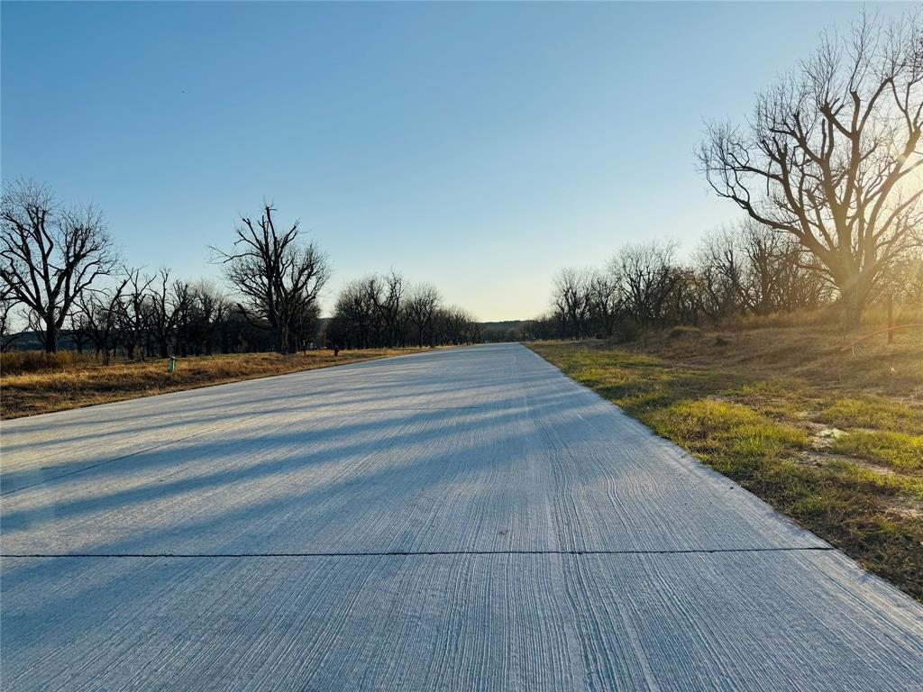 Look no more!!! Incredible opportunity to own a Landing East 1.5+ acre, tree-filled lot in the highly sough-after aviation community of Pecan Plantation! This beautifully wooded homesite offers ample room to design and build your dream home, along with space for so much more. Located within the private, gated Pecan Plantation community, you'll enjoy an exceptional lifestyle with access to top-tier amenities. Including two golf courses, walking trail, a full-service clubhouse, tennis court, swimming pools, river access, and so much more.