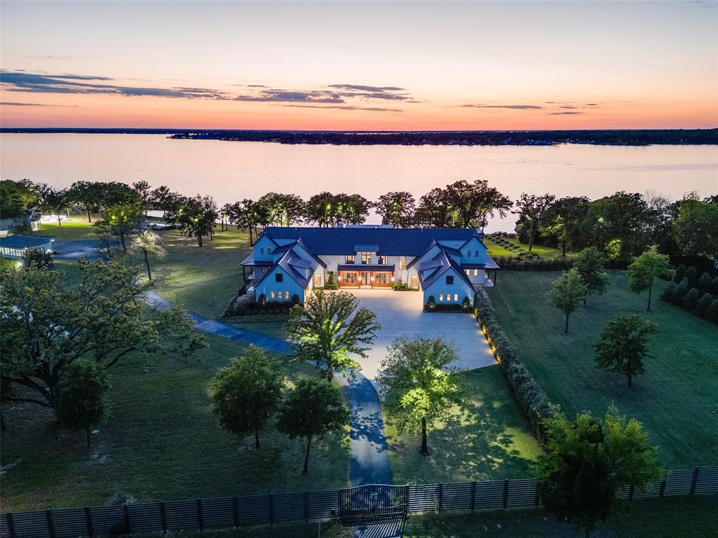 Designed as a place for generations to gather, Barron Road Retreat presents a rare opportunity to own an extraordinary lakefront legacy estate. Situated on 25± meticulously maintained acres with approximately 700 feet of coveted open-water frontage on Cedar Creek Lake, this property blends resort-style living with exceptional privacy. Barron Road Retreat is a host’s dream, comfortably sleeping up to 30 guests between the approximately 9,774-square-foot main residence and three guest casitas. Multiple patios and living areas overlooking the lake provide abundant space to gather while still allowing guests to enjoy privacy and separation. Located on the desirable deeper end of Cedar Creek Lake, the opportunities for boating and lake recreation are unmatched. Every acre of the property has been thoughtfully designed to feel like a private lakefront resort without sacrificing warmth or intimacy. This is a true legacy retreat, equally suited for summer weekends, holiday gatherings, and multi-generational memories for years to come. See Document section for complete description of the property, site plan, and aerial.
