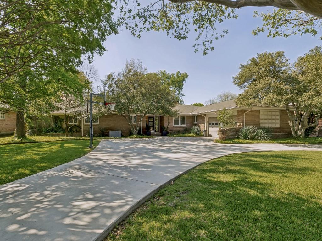 Located in the highly sought after Preston Hollow area, this home beautifully blends mid century charm with a thoughtful modern remodel and expansion in 2020.  Set on a spacious lot with mature trees, the property offers exceptional outdoor living, complete with a swimming pool and spa which is perfect for relaxing and entertaining.  Inside, you will find a bright and open layout featuring a large kitchen with a breakfast nook and expansive family room, all overlooking the beautiful backyard.  The home includes two primary bedroom suites, offering flexibility and comfort for a variety of living arrangements.  Additional highlights include a private study or sixth bedroom, a dedicated media or game room, and separate formal living and dining areas for more refined gatherings.  The primary suite is a true retreat with panoramic views of the pool and features a luxurious ensuite bath with a separate walk in shower, soaking tub, double vanity, and an oversized walk in closet.  With a tasteful blend of color and elegance, this home displays stunning marble surfaces and offers both style and functionality in one of the most desirable areas of Dallas.