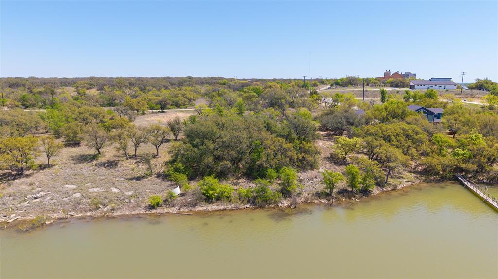 A truly rare opportunity to purchase one or both of these magnificent waterfront properties in highly desired Turner Ranch Estates on beautiful Lake Brownwood. These lots do not come up for sale often. Especially two lots together. You might say this opportunity is rare as hen's teeth. These wonderful lots are accompanied by gorgeous views, vibrant trees, great water depth and excellent building sites. Give us a call today to learn more about this great lake front property.
Additional Lot 22 Available
MLS# 20898668