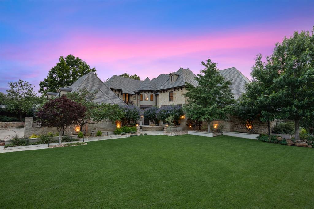 Welcome Home to this private custom estate, nestled on a rare 1 acre creekside & cul-de-sac lot - a setting as remarkable as the residence itself. Lush natural surroundings create a sense of seclusion few properties can offer. Step into a dramatic circular marble Foyer to a world of sophisticated modern design, exceptional craftsmanship & resort-inspired luxury. Chef's Kitchen is a culinary masterpiece - German white lacquer & walnut cabinetry, quartz counters & professional appliance suite: Wolf gas range, Sub-Zero refrigerator-freezer, Bosch dishwasher, Wolf coffee & Wolf micro. The Great Room delivers breathtaking views of the backyard & seamlessly connects to the Dining Room & Kitchen, while expansive Pella Architect Series windows & oversized sliding doors bathe the space in natural light. Family Room-Bar elevates entertaining with a fully custom bar, Sub-Zero wine fridge, icemaker & show-stopping marble accent wall. Primary Retreat is a sanctuary with private courtyard w fire pit, custom Closet + Spa Bath with Dornbracht fixtures, Victoria & Albert volcanic limestone soaking tub, Duravit toilets & automated Kohler KTV shower & wand system. Executive Study with floating built-ins, flexible Guest Suite & large Laundry-Mud room with custom dog wash & dog cubby complete the 1st floor. Upstairs has 3 Bedroom suites, spacious Game Room + dedicated AV closet with mini-split. Outside, the Claffey Pool-designed backyard is a resort unto itself-multiple patios, pergola, fireplace & outdoor kitchen with Wolf grill and Sub-Zero refrigerator & ice maker. The covered patio boasts Bromic mounted gas heaters, phantom shades & perimeter mosquito misting. Lush landscaping & expansive grass areas complete this outdoor paradise. Control4 smart home automation; Martin Logan, Klipsch & Monitor Audio speakers; 9 TVs; Luma security cameras; Nest systems; DaVinci roof w copper accents; 2 new Lennox Elite HVAC systems; tankless H2O heaters; Pentair whole-home filtration; EV charging.