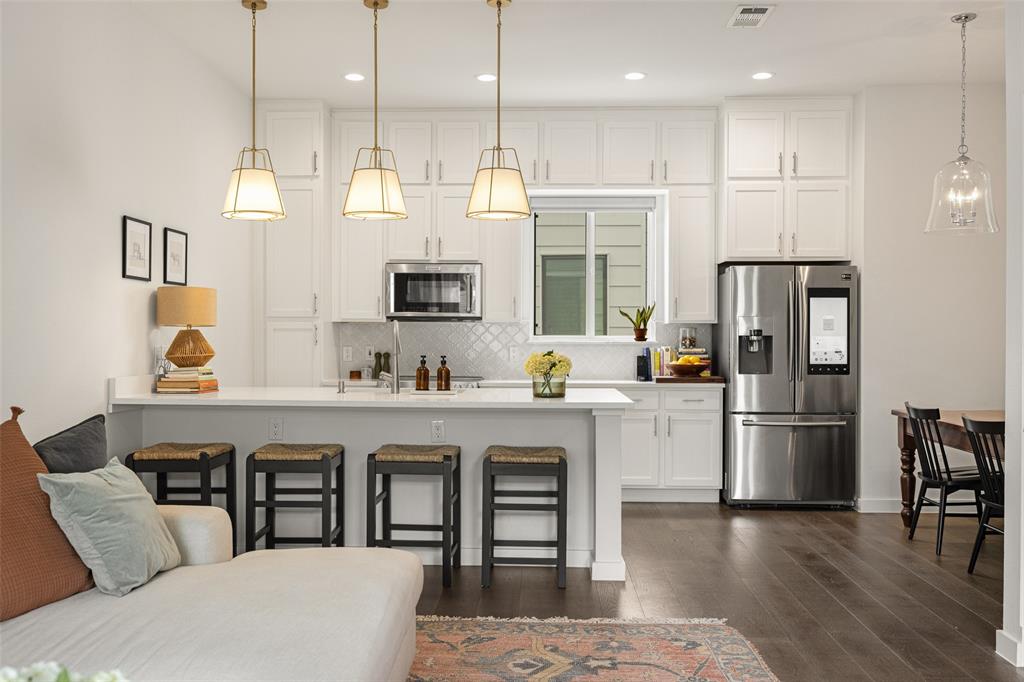 Priced competitively and tucked along a charming, tree-lined street, this beautifully finished three-story condo offers the perfect blend of style, comfort, and value. The first-floor study creates an ideal space for working from home or a quiet retreat, while the main living area is filled with natural light. At the heart of the home, the gourmet kitchen is both functional and stunning featuring stainless steel appliances, sleek quartz countertops, under-cabinet LED lighting, and an island accented with designer pendant lighting that is perfect for everyday living or entertaining. The primary suite offers a relaxing escape with a walk-in closet and a spa-like bathroom complete with dual sinks and an oversized frameless glass shower. All of this, just moments from the shops, restaurants, and vibrant lifestyle of Lower Greenville and Lakewood making it easy to step out and enjoy the best of Dallas. With its high-end finishes, functional layout, and unbeatable location, this home delivers exceptional value at every turn.