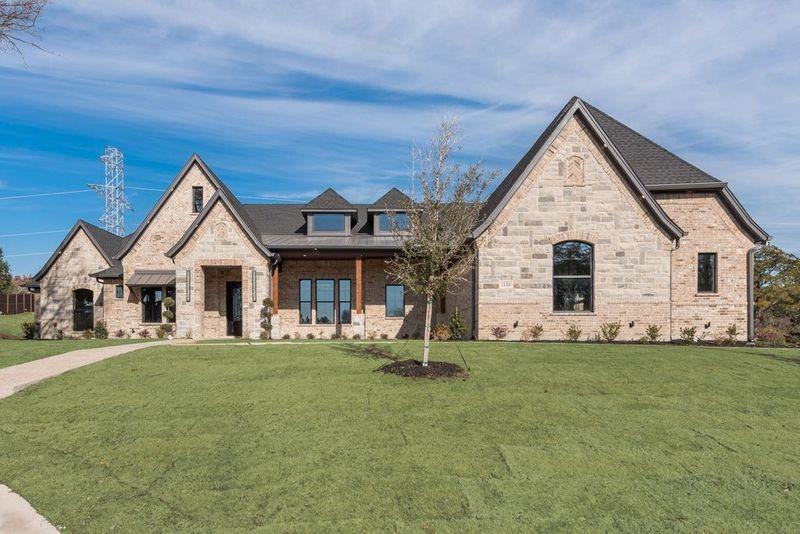 Stunning Designed floorplan offering luxury living in the highly sought-after gated community of Eagle Point Estates. Nestled on a quiet cul-de-sac with serene landscaping, this spacious 1.5-story home combines elegant design with modern comfort.

Step inside to an impressive open-concept layout featuring a large family room with vaulted ceilings and designer ceiling details throughout. An expansive 8-foot folding glass door opens from the first-floor game room to an incredible outdoor living space complete with a three-section patio and outdoor kitchen — perfect for entertaining.

The chef’s kitchen is beautifully appointed with stainless steel and gold appliances, gas cooktop, pot filler, double ovens, microwave drawer, and a massive quartz island ideal for breakfast gatherings or hosting guests. Additional upgrades include custom remote-controlled blinds, spray foam insulation in the walls and attic, and high-end finishes throughout.

All bedrooms are conveniently located downstairs and paired with full bathrooms, while the upstairs features a spacious bonus room with a full bath — perfect for guests, a media room, or additional living space.

Barely lived in and move-in ready, this exceptional home is truly a must-see. YOUR NEXT HOME awaits!