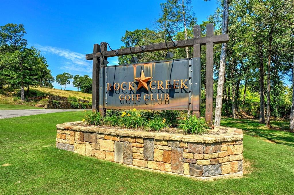 Tucked away on a quiet cul-de-sac, this spacious 0.30 acre homesite offers an excellent opportunity to build your dream home in the highly sought-after Rock Creek Resort on Lake Texoma. Larger than many lots within the community, this property provides additional space for thoughtful home design while still enjoying the privacy and peaceful surroundings that make Rock Creek so desirable.
Rock Creek is a 1,300-acre guard-gated resort community featuring a Jack Nicklaus-designed championship golf course, elegant clubhouse with dining, fitness center, resort-style pool, tennis, pickleball and basketball courts, scenic hiking, and a private marina on Lake Texoma. Ownership enables a golf membership with rounds available each month for additional fee, making it easy to enjoy the course year-round.
With no required timeline to build, you can secure your place in this premier lake and golf community and begin enjoying the amenities immediately while planning your future custom home. Whether you are looking for a weekend escape or a full-time residence, Rock Creek offers a lifestyle that blends relaxation, recreation, and natural beauty.
Buyer and buyers agent to verify all information.