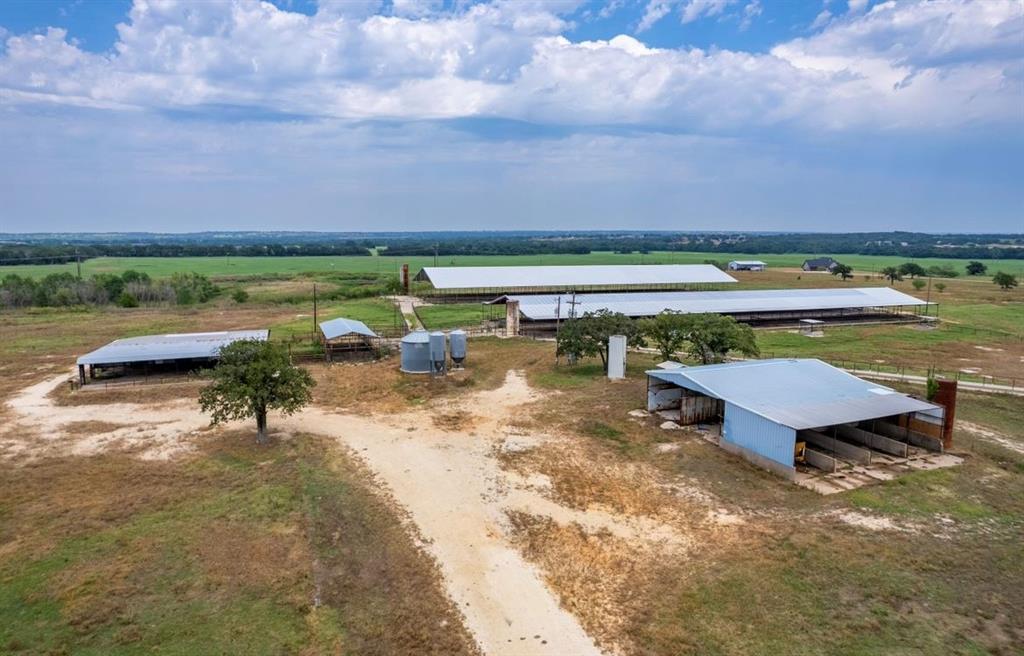 Welcome to everything the Cowboy Capital of the World embodies on this 35 acre restricted Huckabay ISD retreat.  Be the fundamental lead to a brand new development, and operate a horse motel,  stable or training center for the upcoming Palomino Run Development, a planned, horse friendly community convenient to both I20 and Stephenville.  Nestled among sprawling acreage farms, this property includes 2 covered 3400 sq ft barns that could easily be converted to horse stalls or hay storage, covered holding pens, a commodity barn, 3 phase electricity, hay sheds, water well and majority of perimeter fence in place.  Embrace the elevation opportunities by building your dream home on top of the hill and enjoy views for miles.  This is a rare opportunity to be the first and largest land owner within the boundaries of an upcoming subdivision. Additional acreage available. Call to schedule your private showing today!