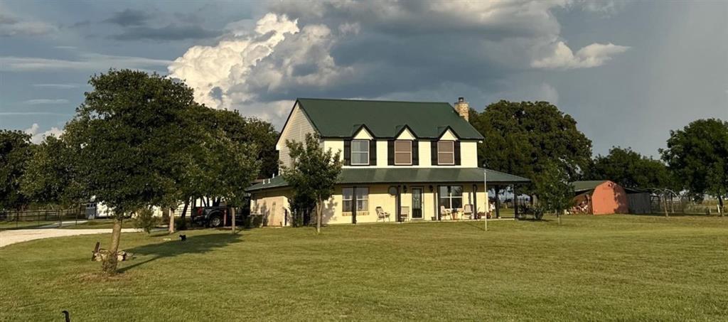 Experience the perfect blend of farmhouse charm and modern convenience on this charming 24-acre property, ideally located in the highly sought-after Tolar school district and just minutes from Granbury's shops and amenities. Set well off the road for privacy, this 2-story, farmhouse-inspired home offers nearly 360-degree scenic views with peaceful pastures, mature trees, and vibrant sunsets from the wraparound porches.

Inside, you'll find a spacious, open-concept layout with a huge kitchen, ideal for entertaining, and a cozy Xtrordinair high-performance fireplace. The primary suite is downstairs, featuring dual closets and a luxurious ensuite bath with a whirlpool tub and oversized shower. Upstairs includes three additional bedrooms and a full bath, perfect for family or guests.
This home was designed with both comfort and practicality in mind, featuring radiant floor heating, zoned AC, a metal roof, a security system, a built-in gun safe, and is generator-ready for peace of mind.
Step outside to enjoy a covered patio with a fireplace and firepit, 3-car carport, and an impressive barn-shop with concrete floors, a sink, an RV hookup, covered RV parking, and 4 horse stalls. The acreage is fully usable, with cross-fencing, holding pens, and water access for animals, perfect for cattle, horses, or other livestock.
This one-of-a-kind property offers unmatched versatility, breathtaking views, and all the modern features needed for comfortable country living.


*All information is to be verified by the buyer and the buyer's agent.