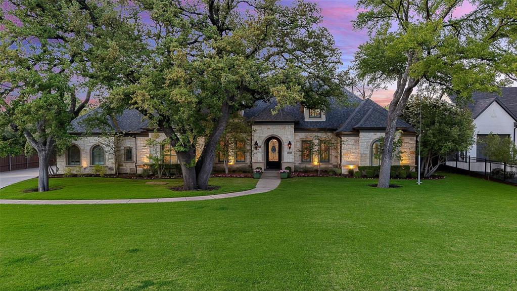 Yes, it’s on the corner of Preston Road. No, you won’t believe how quiet it feels! Thoughtfully positioned on a north-south corner lot in Preston Hollow, this 6,400-square-foot home delivers what buyers rarely find: privacy, functionality, and a peaceful atmosphere both inside and out. Built with quality construction, the layout simply works. Oversized rooms, natural gathering spaces, and flexible separation between entertaining and everyday living create a home that feels comfortable and livable from the moment you walk in. The first floor offers an ideal setup for multigenerational living with a spacious primary suite, dedicated office, and two additional en-suite bedrooms downstairs. Multiple living and dining spaces allow everyone to spread out, while the updated kitchen opens naturally to the heart of the home. A separate bonus room with full bath near the pool creates options for a playroom, gym, pool cabana, or guest space. Upstairs, the home shines for modern living with two additional en-suite bedrooms, a large game and media space with wet bar, and a separate art studio. Whether it’s movie nights or homework zones, this floor plan gives everyone room to live comfortably. Outside, the covered patio overlooks the pool and expansive yard, offering rare usable space. Mature landscaping and thoughtful orientation create an unexpectedly quiet backyard retreat that feels removed from the city. Complete with a three-car garage and a floor plan designed to evolve with every stage of life, this is the Preston Hollow home buyers wait for: substantial without feeling overwhelming, functional, and quiet in all the ways that matter.