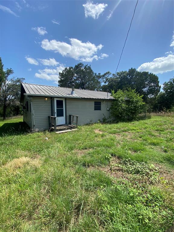With some TLC this can be your next home or INVESTMENT property.....1 bed 1 bath plus 2 BONUS rooms........FENCED with 2 drive thru gates.......almost half acre with 20,185sf lot.........NO HOA........No city TAXES........LARGE SHED......Very private.......Metal Roof.....Sold AS IS