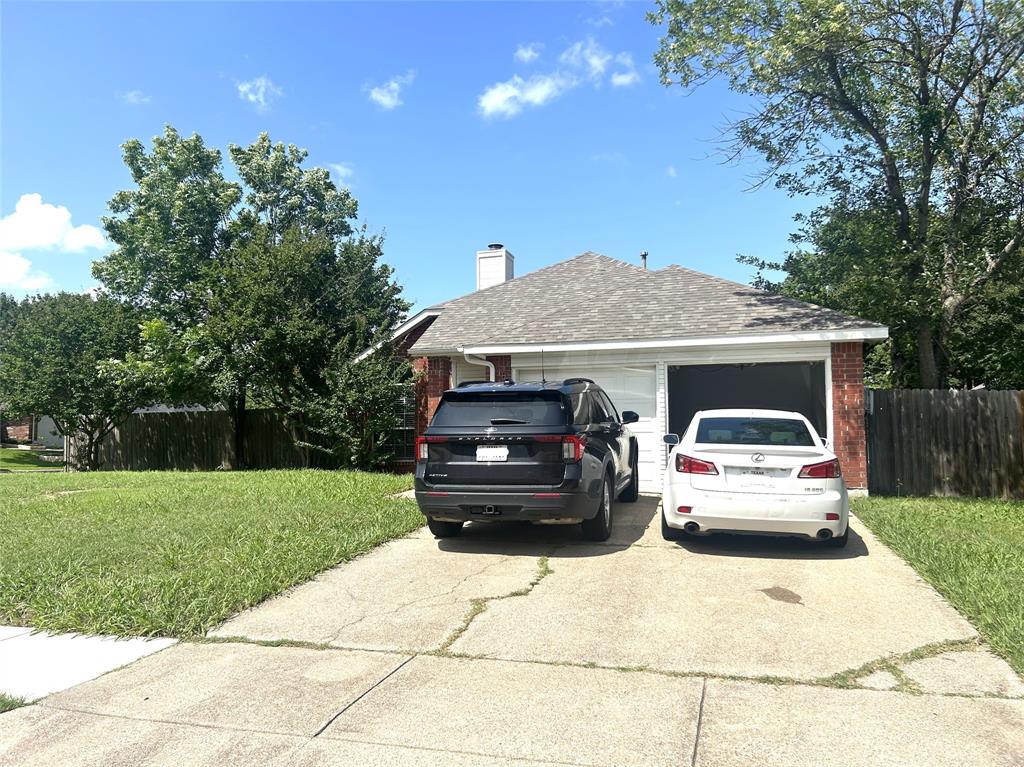 Welcome to this open floor plan, charming one-story home sitting on an oversized corner lot in the city of Rowlett.  This home features three bedrooms, 2 full baths, and a 2-car garage.  With a large covered patio and a big back yard there's plenty of space to do your gardening, or getting together for a BBQ or just relaxing.  Plenty of parking space. The fire station is a block away.  This home is close to a golf course, close to Lake Ray Hubbard, grocery stores, restaurants, coffee shops, and hospital.  Easy access to George Bush Tollway and Hwy 30.  Seller will leave refrigerator and washer & dryer for buyer.  Buyer and buyer's agent to verify all info.