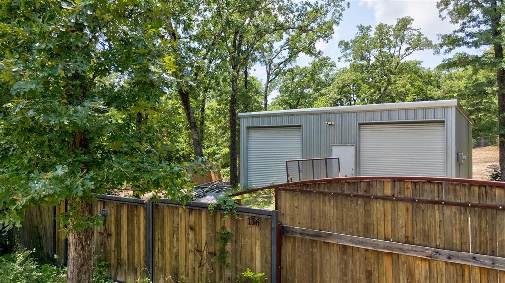 Located in Malakoff within the desirable Eustace ISD, 136 Kings Row offers a versatile piece of property with tremendous potential. Sitting on a fully fenced lot, this land features a 30x30 fully insulated and climate-controlled metal building, complete with a full bathroom and stand-up shower. The metal building provides a strong foundation for anyone looking to create a residence, workshop, studio, or flexible living space. Utilities are in place much of the heavy lifting has already been done for future development. Conveniently located just minutes from Eustace schools, this property offers privacy, functionality, and the perfect starting point to build out your vision in a peaceful and well-maintained community. Septic not installed yet but will be with acceptable offer.