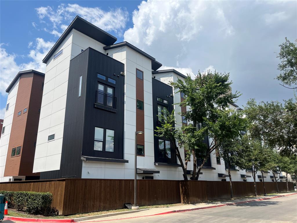 LOCK AND LEAVE Sleek 2-Bed, 2.5-Bath Full 2 car gar, Luxury Townhome-Style Condo in the Heart of Live Oak Discover modern city living in this beautifully designed condominium located in a boutique 14-unit complex in Dallas sought after Live Oak neighborhood. Offering a perfect blend of luxury, location, and lifestyle, this home places you just minutes from Downtown Dallas, the vibrant Cedars District, and your neighborhood Tom Thumb. Step inside to soaring 12-foot ceilings, designer lighting, and an open-concept living space with upscale finishes throughout. The gourmet kitchen equipped with contemporary appliances, expansive counter space, and sleek European-style cabinetry, ideal for everything from quick weekday breakfasts to hosting stylish dinner parties. The spacious primary suite provides peaceful retreat, complete with a spa-like ensuite bath, generous closet space, and whisper-quiet drawers and doors. The second bedroom, with its own private bath, is perfect for guests, family, or a dedicated home office. Enjoy a unique entertaining feature, a dry bar just off the balcony offering stunning Downtown skyline views, ideal for evening cocktails or weekend gatherings. Premium Upgrades & Smart Features Include 4 Nest Smart Thermostats for intelligent climate control and energy savings Ring Door Camera & Keyless Smart Lock, Whole Home Electric Blinds with remotes on each floor, High-End Paint throughout with 100% acrylic, ultra-durable finish Energy Efficient Washer, Dryer, Fridge with designer sphere ice, Custom Closet, Bathroom Shelving for maximized storage, Epoxy Coated Garage Floor for a polished, low-maintenance finish Lifestyle Highlights, Live steps from top dining, boutique shopping, concert venues, and Dallas nightlife. Whether it's brunch, business, shopping or spontaneous adventure, everything is within a short distance This home is perfect for professionals or anyone looking for a stylish, city base that doesn’t compromise on comfort or convenience.