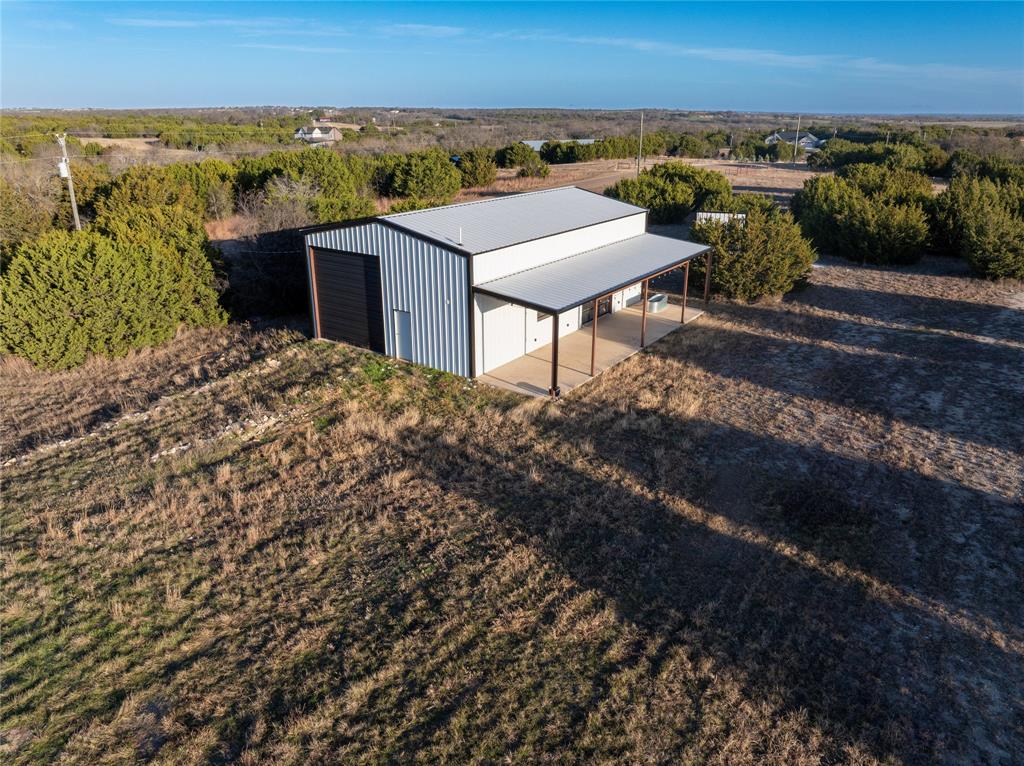 5.01 acres in Rio Vista, perfect corner lot, fully fenced, well, MUST SEE Drive-Through Shop, build your dream home here!

This shop is truly a must see! Situated on a perfect corner lot, this fully fenced 5.01-acre property offers a large flat area ideal for building your dream home. With dual street access, you have flexibility and convenience. The shop is approximately 30 ft by 50 ft , about 1500 square feet, plus a 12 ft front porch. A must see! It has true drive through access with multiple overhead or dock style doors on both sides, including window panels for natural light and visibility. The possibilities are endless! Great setup for storage, equipment, projects, or a workshop. Schedule a tour to see the shop and property layout in person!

Located in The Ranches at Eagle Ridge with easy access to Rio Vista, Cleburne, Burleson, and Fort Worth. Enjoy local stops like Heathers Coffee and Sandwich Shop and outdoor recreation at Hamm Creek Park with Brazos River access. Buyer to verify all details, utilities, restrictions, POA requirements, permits, and building feasibility.