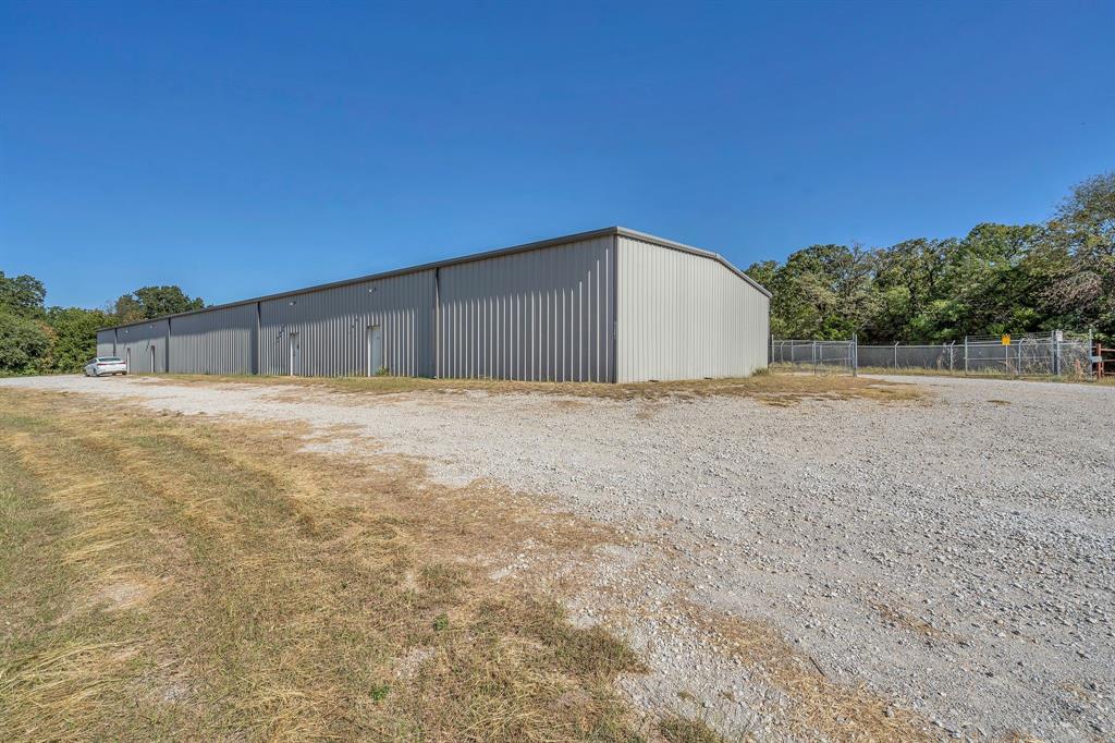 Prime Commercial Opportunity off HWY 287! Situated on 5.1 acres in a designated Opportunity Zone, this impressive property features three 10,000 sq. ft. buildings, offering flexibility for a variety of industrial, commercial, or investment uses. Two of the buildings include 3-phase power, making them ideal for manufacturing or heavy equipment operations. Buildings 1 and 2 were thoughtfully designed to be divided into two 5,000 sq. ft. units, each with two restrooms per side — for a total of four restrooms per building. Currently, both are set up as wide-open spaces for maximum versatility. Building 1 includes an open bay and one finished office, providing functional workspace right away. Additional highlights include a helipad, ample acreage for parking or future expansion, and excellent visibility and access from HWY 287. This property presents endless potential for business growth or investment in a rapidly developing area!