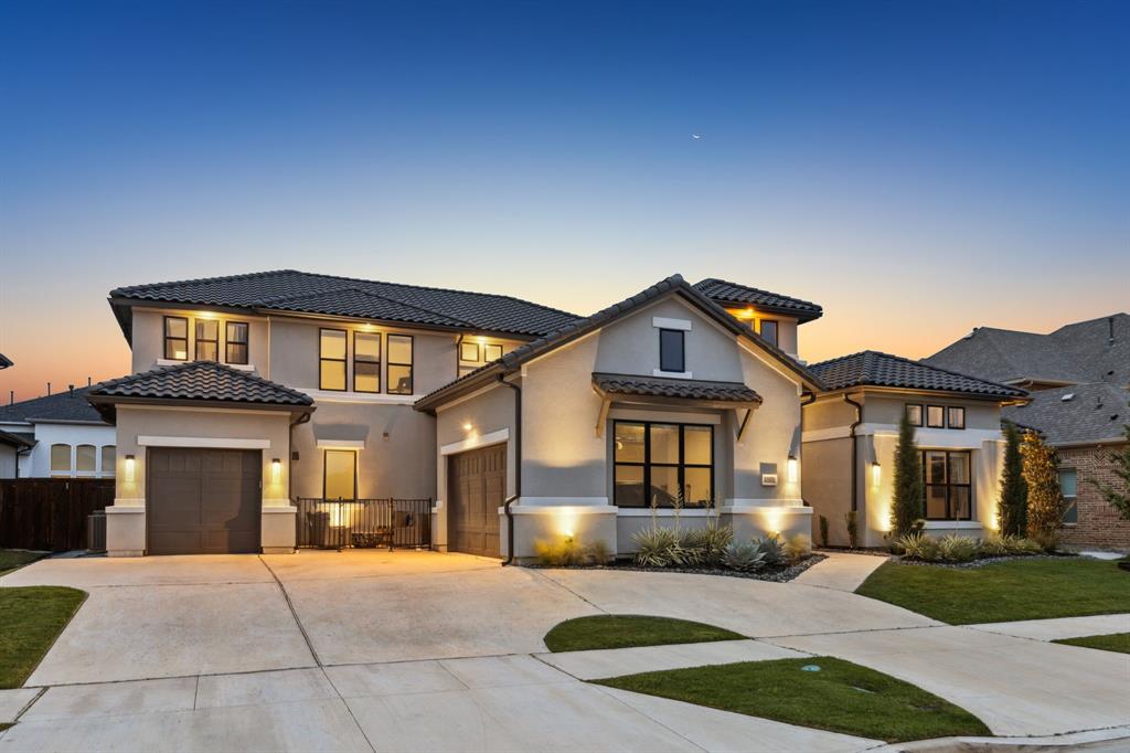 Situated in the gated and guarded community of Lexington in Frisco, this well-designed estate offers many luxury designs with a well-thought-out floor plan, making spaces for everyone! There are hundreds of thousands of upgrades to enjoy! Every inch of this home has been designed with a crafted blend of elegance & modern comfort from its two office suites, in-law suite, grand living and kitchen space, downstairs game room & media room, and don't forget fabulous outdoor living!  The gourmet chef's kitchen is a culinary masterpiece, boasting top-of-the-line appliances, a built-in refrigerator, and a large center island with counters covered with custom quartzite. Seamlessly flowing into the dining room & family room, a wall of door sliders line the wall where you can open it up to bring you to your resort-style pool and lush backyard sanctuary.  The covered patio features a fireplace and grilling area; you can close this area off with the electric screen. Feel like a dip in the pool? Enjoy this pool by lounging on the pool's lounge chairs or swimming. There is plenty of extra grass for play, too!  The primary suite is nestled in the back of the home for extra privacy and features a sitting area, a bath with separate vanity spaces with quartzite c-tops, a walk-in shower, a soaker tub, and a custom-designed walk-in closet. This room is finished off with the vaulted ceiling and beam. The downstairs in-law suite includes a private sitting room with a built-in bar, an adjoining bedroom, and a private bath. Walk up the staircase to a living space with three generously sized bedrooms, each with a private bath. Other features of this home you won't want to miss are the secondary cooktop area in the utility room, prayer room, and 3-car garage. You will enjoy walking through each room of this home and taking in the architectural design features added to make each room special.