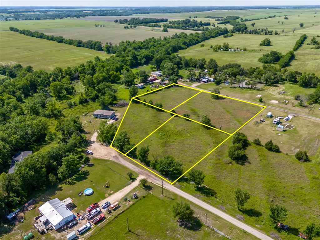 Discover the possibilities with this 3.6± acre property consisting of four platted lots across two separate parcels, located just 7 miles South of Paris. Conveniently situated off Highway 24, this unrestricted tract offers water and electric availability on both the north and south portions of the property, partial fencing, and access from two separate county roads—County Road 23070 and County Road 23080. Buyers may also explore the opportunity to purchase the North and South parcels separately.  

Great location to build your dream home, place a manufactured home, establish a hobby farm, create a weekend retreat, develop an RV setup, or invest in land for the future, this property truly offers versatility and freedom to make it your own.

The acreage features native grasses, multiple access points, and a layout that offers a variety of potential uses. Comprised of four lots, the property provides added flexibility while maintaining the privacy and peaceful atmosphere of country living.

Enjoy the benefits of being outside city limits while remaining just minutes from Paris and everyday conveniences. Bring your vision and explore the opportunities this unique property has to offer.