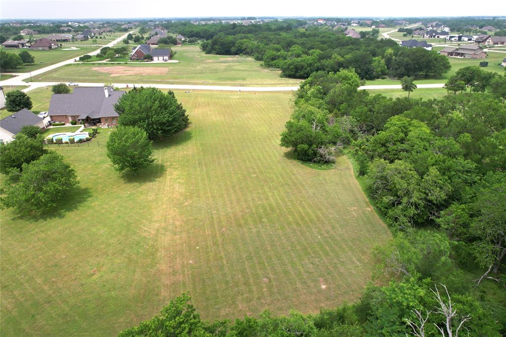 High Point Ranch is one of the most sought-after custom-home communities in the area, and this premium 2-acre lot is your opportunity to own one of its most coveted properties — offering the perfect combination of land, lifestyle, and privacy.
Surrounded by mature trees with no neighbors behind, the lot provides a peaceful, nature-filled setting where deer are often seen in the mornings and evenings. The surroundings feel a world away from everyday life, yet the community is close to everything you need. The community offers scenic walking trails, tranquil lake access, fishing, and a playground.
No city property taxes, horse-friendly acreage, and plenty of room to build the home and lifestyle you've always imagined.
Schedule your tour today, experience the peace and privacy this property offers and see its full potential.