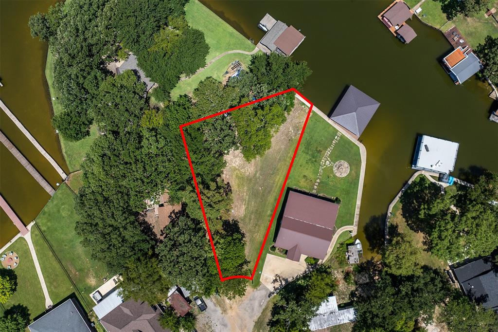 Looking for the perfect getaway? This waterfront lot on Cedar Creek Lake offers everything you need to turn your dreams into reality. Nestled in a quiet cul-de-sac, this peaceful property provides the ideal setting to build your dream cottage, barndominium, or cozy fishing cabin, the possibilities are endless! With direct lake access, it’s a boater’s and angler’s paradise, perfect for fishing, kayaking, or just relaxing by the water. You'll enjoy the serenity of lake life while being just minutes from town, with restaurants, grocery stores, and shops all within easy reach. Whether you're looking for a private retreat, a second home, or a short term investment opportunity, this lot has unbeatable potential. Don’t miss your chance to own a slice of lakeside paradise on one of Texas' most popular recreational lakes!