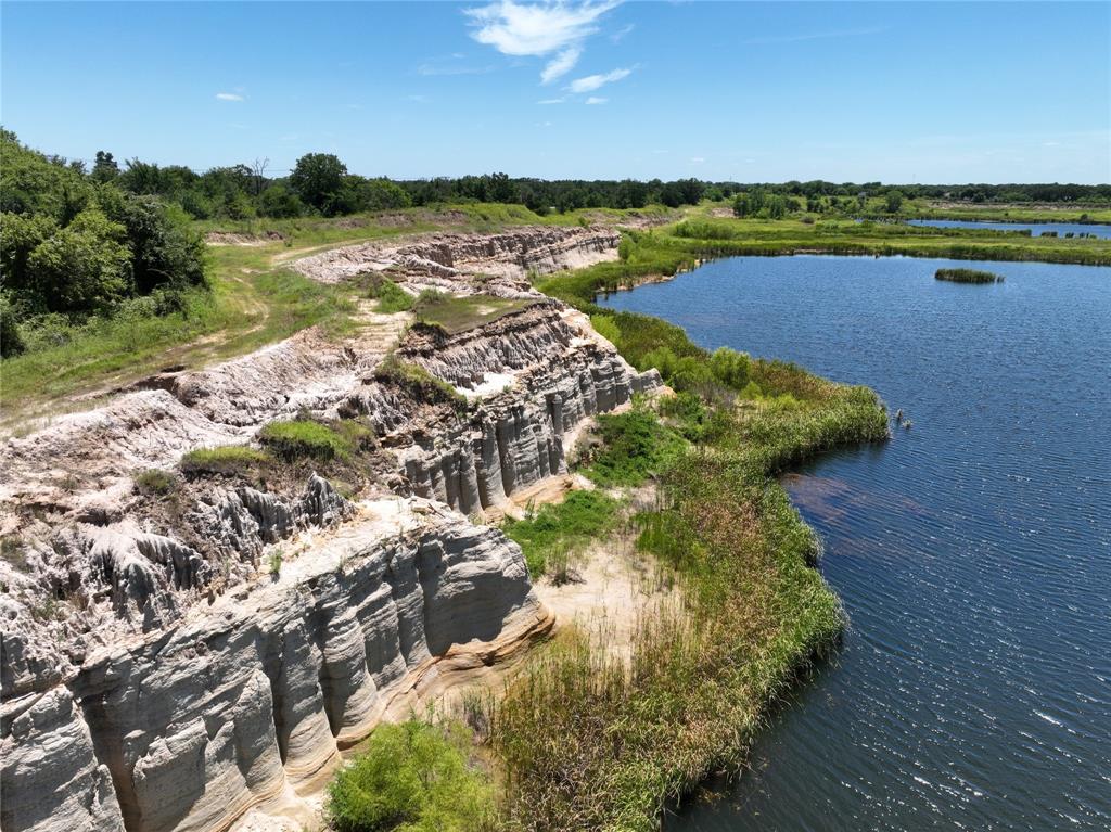 Whether you're dreaming of a residential estate, planning a commercial development, creating a recreational retreat, or envisioning fisheries and hunting grounds, this property offers the scale and flexibility to bring your vision to life. With ample acreage, it's ideal for subdividing into custom home sites or ranchettes. A unique body of water on the property presents a rare opportunity to develop a private lake or fully stocked fishery, enhancing both value and lifestyle appeal.

Importantly, this land is not located in a flood zone, offering peace of mind for future development and minimizing insurance concerns.

Situated in the fast-growing Poetry community, the property blends rural charm with strong investment potential—all just a 38-minute drive to Dallas via I-30. Whether you're a developer, investor, rancher, or someone seeking a blank canvas, this is a truly rare opportunity in one of North Texas’s most desirable emerging areas.