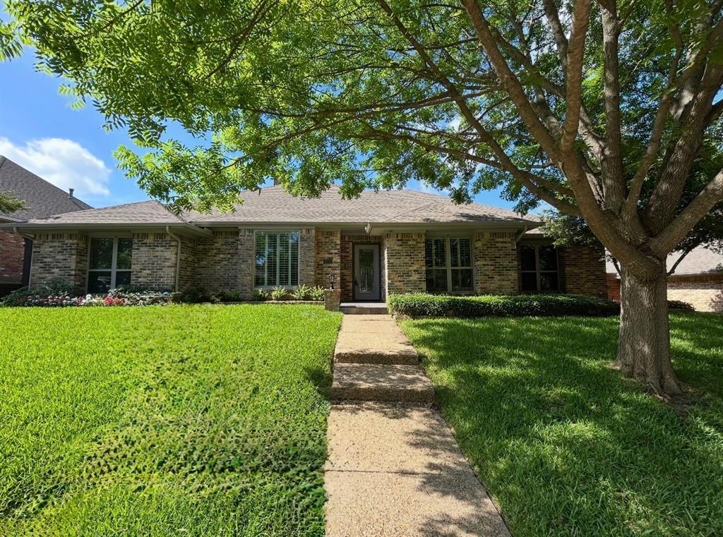 Tastefully updated, meticulously maintained home located in the highly sought-after Lake Highlands neighborhood and desirable Richardson ISD. This home features 4 bedrooms, 3 full bathrooms, 2 living areas and a study. Ten-foot ceiling heights and open floor plan create a comfortable yet sophisticated living area with a gas log fireplace, wet bar, and plenty of windows offering a panoramic view of the backyard oasis. Updated eat-in-kitchen that opens to the living area through a breakfast bar is perfect for entertaining and features granite countertops, Kitchen Aid double ovens, 6 burner Viking induction cooktop, built-in microwave and Avanti wine fridge. Adjacent to the kitchen is a sizable 2nd living dining space that leads to a private bedroom and bathroom area creating the perfect mother-in-law suite. Luxurious primary bedroom boasts 9-foot ceilings and French doors access the covered patio, sparkling pool and spa, lush landscaping and turfed areas for minimal maintenance. The en-suite bath includes a large walk-in shower, private water closet, double vanity and 2 walk-in closets. Secondary bedrooms and bathrooms are spacious and ideally appointed. Separate laundry-mud room opens to the backyard and garage.  Other updates include wood laminate flooring and recently painted throughout, decorative light fixtures and ceiling fans, 8-foot board on board fence with arched gates, updated electrical box with surge protector, all new concrete retaining wall, attic insulation with cellulose and fiberglass blown in R-30 insulation, roof-gutters, windows and more.