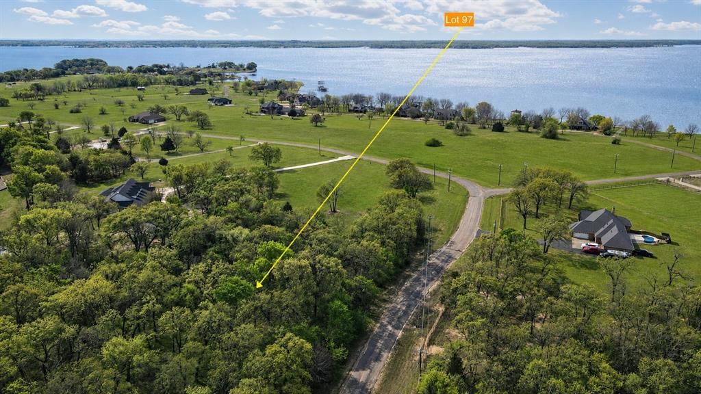 Start making your plans to escape to your own private retreat with this exceptional 1.57-acre corner lot in the highly sought-after Arrowhead Subdivision. With the security of the gated entrance this stunning property offers the perfect balance of privacy, convenience, and natural beauty, featuring mature trees and a serene, picturesque setting. Site-built homes only, with a minimum of 2,000 square feet and no time limit to build, giving you the flexibility to plan your perfect lakeside retreat at your own pace. Arrowhead offers a community boat ramp, pier, and mailbox, offering easy access to water activities and daily conveniences. Located within Mildred ISD, making it a perfect location for families seeking both a peaceful lifestyle and excellent schools. This property is an extraordinary opportunity to create a custom home in a tranquil, lakeside environment. Whether you're looking for a year-round residence or a seasonal getaway, Arrowhead provides the ideal backdrop for relaxation and enjoyment. Don’t miss out on the chance to own this piece of paradise!