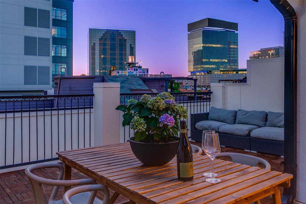Location is everything! Experience the best of city living in this immaculately maintained turn-key townhome, located mere steps from some of Dallas' newest parks, acclaimed restaurants, and the bustling downtown Farmers Market! Entering from your private fenced in yard, step inside to gorgeous arched ceilings, crisp clean lines, and an abundance of natural light. The first level showcases an expansive secondary bedroom with its own ensuite bath, along with the spacious two-car garage complete with an oversized garage door and additional storage space. On the second floor you’ll find soaring ceilings to accompany the open concept living, dining and eat-in kitchen area, all anchored with rich, newly refinished hardwoods throughout. Cook up a storm in the chef-inspired kitchen, which includes new stainless steel appliances and beautiful, recently repainted custom cabinetry and a great size pantry. Taking you to the third level you’ll have an additional secondary bedroom with another ensuite bath, along with the show-stopping owner’s retreat, which allows for ample space for a second sitting area or home office, and the walk-in closet of your dreams! No detail has been spared in the maintenance of this gorgeous townhome - even on the rooftop deck - providing stunning 360 degree views of neighboring Deep Ellum and downtown. Enjoy true lock-and-leave living with low HOA in this sophisticated, tucked-away oasis with an incredible walking score of 95! This isn’t just a home, it’s a lifestyle.