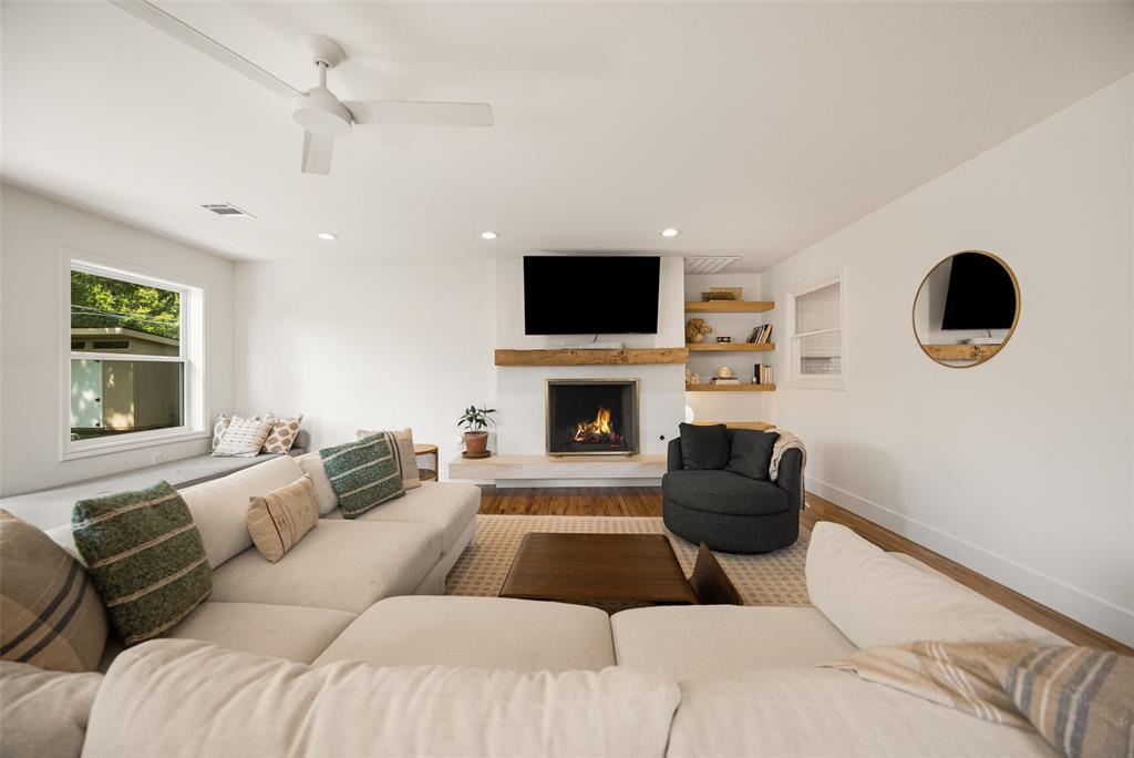 Welcome home to this tastefully appointed Lochwood gem, where warmth, character, and thoughtful design come together in one of Dallas's most beloved neighborhoods. This effortlessly charming 3 bed, 2 bath jewel box offers 2095 square feet of inviting space designed for both everyday living and endless entertaining. With two generous living areas and an open floor plan, there's room for everyone to gather, relax, and make memories. The heart of the home is the expansive family room, anchored by a cozy fireplace and bathed in natural light that pours through every corner. Gorgeous hardwood floors flow throughout, adding a timeless elegance to every step. Retreat to the spacious primary suite, a true sanctuary. The ensuite bathroom impresses with designer finishes, dual vanities, a walk-in shower, and a luxurious soaking tub, while a custom closet keeps everything neatly organized. A well appointed laundry room and one car attached garage add functionality and convenience to this lovely home. Outside, discover your own private backyard oasis. Lush, secluded, and intentionally designed with multiple seating areas, this outdoor space is made for weekend gatherings, quiet evenings, and everything in between. A custom chicken coop adds a charming and functional touch for those who love fresh eggs and a little urban homesteading. Beyond your doorstep, Lochwood delivers an incredible lifestyle. Enjoy the neighborhood greenbelt, walking and jogging paths, tennis courts, and parks, all framed by the canopy of mature trees that make this community so special. Just minutes from White Rock Lake, offering miles of trails, kayaking, picnicking, and breathtaking views year round. Take a short drive to Casa Linda for an eclectic mix of local dining, boutique shopping, and everyday conveniences. With easy access to 635 and I-30 for a smooth commute to Downtown Dallas, this is truly in the heart of the city. This is more than a house, it's the home you've been waiting for.