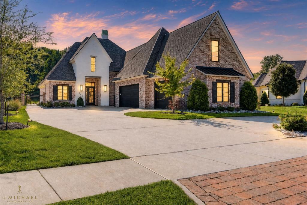 The stunning blend of elegance, high-end fixtures, and attention to details are sure to impress in this 5-bedroom, 3-bathroom home in gated Esplanade. The circle driveway and professional landscaping offer immediate curb appeal as you arrive. Inside, gorgeous hardwood floors lead from the foyer into the spacious living room, boasting a coffered ceiling, custom built-ins with solid wood shelving, and unobstructed views of the crystal-clear waters of the backyard pool. Entertaining guests both inside and outside will be a breeze thanks to the outdoor kitchen and living space, whole home integrated sound system and outdoor speakers, while the Jellyfish lighting will bring a soft ambience to evening dips in the pool or hot tub. Control both the lights and pool with an app on your phone. Self-cleaning features ensures easy pool maintenance and it's both heated and cooled for use all year round. With no backyard neighbors, you'll have both peace and privacy. The gourmet kitchen includes a large center island, custom cabinetry, upgraded stainless appliances including a Cafe refrigerator and Cafe Sonic nugget ice maker, and flows seamlessly into the formal dining space. A walk-in pantry ensures you have enough storage for all your culinary needs. The oversized primary suite with vaulted ceiling and spa-like ensuite bath is sure to be a favorite spot to relax - with dual sinks, a soaking tub, and custom tiled shower, you'll be able to unwind in luxury after a long day. The 4 additional bedrooms are split with one downstairs and the other 3 upstairs, offering you flexibility for family, guests, or a dedicated study. One of the bedrooms upstairs can be used as the 5th or a bonus room that can convert to a media space, game room, or playroom - this home truly offers the flexibility to meet your unique needs. Located just minutes from local shopping and dining, as well as I49 for easy travel, this home is sure to be at the top of your list! Schedule your private tour today!