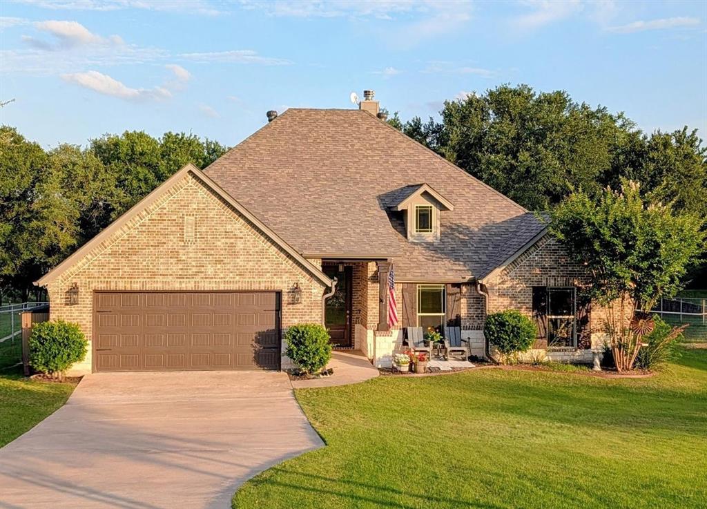 Built in 2018 and located in the highly sought-after Glen Rose ISD and in Somervell County, this exceptionally maintained 4-bedroom, 2.5-bath home offers 2,581 square feet of move in ready living space with convenient access to the Metroplex via the Chisholm Trail Parkway. Inside, the spacious and inviting floor plan features fresh interior paint throughout and a large, farmhouse style ceiling fan anchoring the main living area. The exterior boasts premium upgrades designed for ultimate outdoor living and peace of mind. A massive, newly added 1,800+ square foot concrete patio serves as the ultimate entertainment space, surrounded by mature oak trees showcased through recent professional clearing, a beautiful new cedar and iron privacy fence, and new sod with a dedicated irrigation system. Storage is effortless with a large garden shed ideal for riding mowers and yard equipment, while a charming new front paver patio and updated landscaping deliver excellent curb appeal. One of the home's most significant value-adds is the brand new, certified Impact-Resistant roof installed in Fall 2025, offering immediate premium savings on homeowner’s insurance. Delivering a rare blend of modern upgrades, functional space, and an ideal location, this property is entirely move in ready.