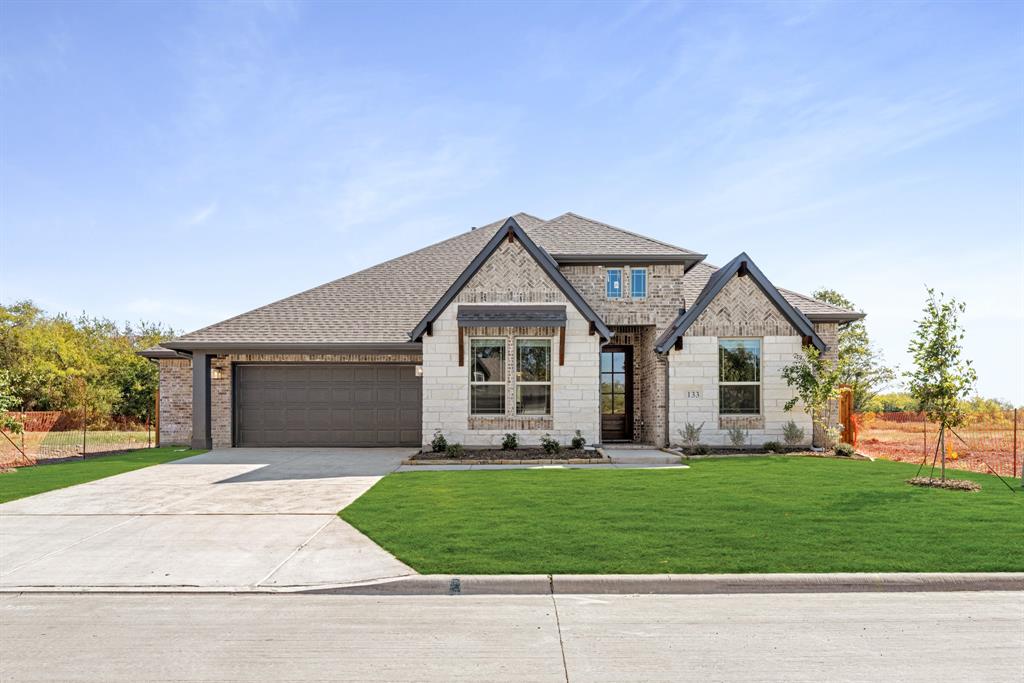 NEW! NEVER LIVED IN. Ready NOW! The Caraway plan from Bloomfield Homes is a thoughtfully designed single-story home with 4 bedrooms, 3 baths, and a versatile 2.5-car garage. Its open-concept layout is anchored by a bright Family Room with oversized windows and soaring ceilings, highlighted by a stacked stone-to-ceiling fireplace with a cedar mantel. Upgraded tile flooring flows through the main living spaces, blending durability with modern style. The Deluxe Kitchen is equipped with Pure White Shaker cabinets, Quartz countertops in Astoria White, built-in stainless steel appliances including a double oven, and a wood vent hood above a gas cooktop. Functionality shines with extras like a pull-out trash bin, motion-sensor pantry lighting, pendant and under-cabinet lighting, and raised panel backs at the island. Bedroom 2 serves as a private suite with its own full bath, while Bedrooms 3 and 4 are tucked on their own wing, connected by a shared hall bath. The spacious Primary Suite is a retreat at the rear of the home, complete with dual vanities, a drop-in deck mount tub, a separate shower with seat, a linen closet, and a walk-in closet that conveniently connects to the utility room. Outside, the brick-and-stone exterior with upgraded buff mortar, cedar garage doors, and a welcoming brick front porch creates standout curb appeal. A covered patio with a ceiling fan, a gas stub, and full gutters extends the living space outdoors. Visit Bloomfield Homes at East Oak Creek in Commerce today to make it yours!
