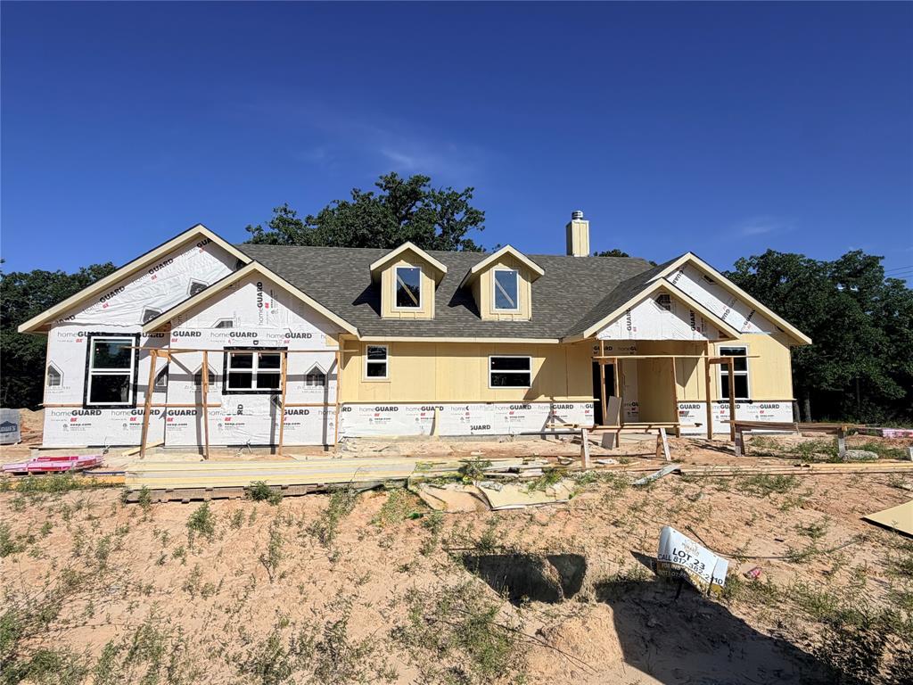 Construction has started! This beautifully crafted home showcases a spacious, open-concept design with 3 bed & 2 bath. The heart of the home is the large kitchen island that seamlessly connects the kitchen to the living & dining areas, all drenched in natural light from ample windows. Custom painted cabinetry with quartz countertops. Luxury vinyl plank floors in the common areas with carpet in the bedrooms & accent tile in baths & laundry. The living room boasts a vaulted ceiling, creating a sense of openness, while the master suite features a chic barn door leading to the en-suite bath with dual sinks, walk-in all tiled & frameless glass shower, & a closet for 2! Nestled on 2 secluded rural treed acres. This Duncan plan is fully equipped with all the features one would expect from a custom home, including split bedrooms, spacious porches, custom cabinetry & closets, Delta faucets, a concrete driveway, decorative mirrors, wall-mounted TV outlets, & hardline Ethernet ports. The builder has invested in high-quality details such as spray foam insulated walls & more. The two-car garage is thoughtfully designed with can lighting, a smart MyQ side-mount garage motor, & an auto-lock system for added security. The expansive back porch is perfect for hosting gatherings or simply enjoying peaceful evenings. NO HOA & NO CITY TAXES! Estimated completion is December. Theres still time for you to make selections, you can tailor it to suit your unique needs. Home has 3-phase inspected & a comes with 1-2-10 3rd Party Warranty for your peace of mind. Images depicting a model home. Features & finishes are subject to change. Located just 20 minutes from Weatherford’s amenities and a quick 45-minute drive to the vibrant Fort Worth metroplex, you’ll have the best of both worlds: the peace & privacy of country living with easy access to city comforts. Txt keyword ZHB35 to 88000 for customization details & info on this semi-custom home! Directions & lot map at www.zhb.homes