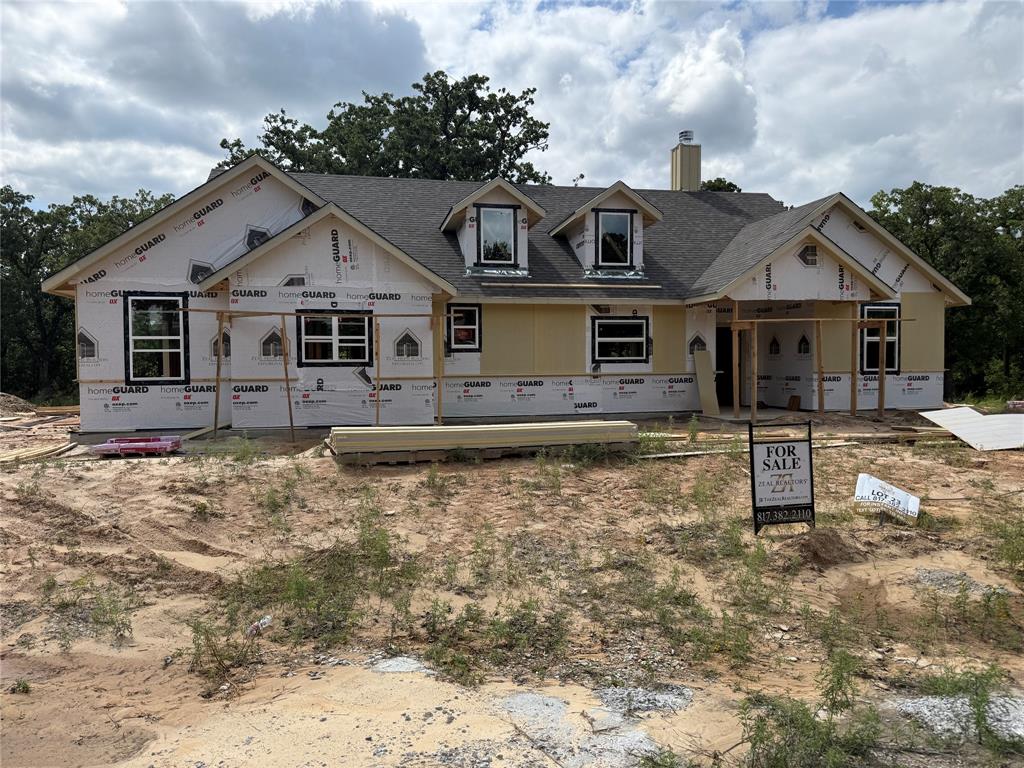 Construction has started! This beautifully crafted home showcases a spacious, open-concept design with 3 bed & 2 bath. The heart of the home is the large kitchen island that seamlessly connects the kitchen to the living & dining areas, all drenched in natural light from ample windows. Custom painted cabinetry with quartz countertops. Luxury vinyl plank floors in the common areas with carpet in the bedrooms & accent tile in baths & laundry. The living room boasts a vaulted ceiling, creating a sense of openness, while the master suite features a chic barn door leading to the en-suite bath with dual sinks, walk-in all tiled & frameless glass shower, & a closet for 2! Nestled on 2 secluded rural treed acres. This Duncan plan is fully equipped with all the features one would expect from a custom home, including split bedrooms, spacious porches, custom cabinetry & closets, Delta faucets, a concrete driveway, decorative mirrors, wall-mounted TV outlets, & hardline Ethernet ports. The builder has invested in high-quality details such as spray foam insulated walls & more. The two-car garage is thoughtfully designed with can lighting, a smart MyQ side-mount garage motor, & an auto-lock system for added security. The expansive back porch is perfect for hosting gatherings or simply enjoying peaceful evenings. NO HOA & NO CITY TAXES! Estimated completion is December. Theres still time for you to make selections, you can tailor it to suit your unique needs. Home has 3-phase inspected & a comes with 1-2-10 3rd Party Warranty for your peace of mind. Images depicting a model home. Features & finishes are subject to change. Located just 20 minutes from Weatherford’s amenities and a quick 45-minute drive to the vibrant Fort Worth metroplex, you’ll have the best of both worlds: the peace & privacy of country living with easy access to city comforts. Txt keyword ZHB35 to 88000 for customization details & info on this semi-custom home! Directions & lot map at www.zhb.homes