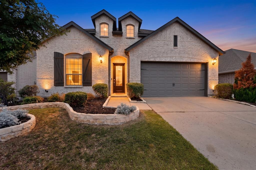 Lender offring a 12 month interest rate buy down! This beautifully designed Highland Homes residence combines timeless elegance, thoughtful upgrades, and exceptional curb appeal in the highly sought-after community of Sandbrock Ranch. The striking white brick exterior, charming bay windows, and professionally maintained landscaping create a stunning first impression, while the interior showcases quality craftsmanship and attention to detail throughout.

Designed for both comfort and versatility, the home features a spacious primary suite, an inviting family room anchored by a dramatic floor-to-ceiling stone fireplace, and a dedicated office that can easily serve as a fifth bedroom, guest suite, or flex space to fit your lifestyle. Architectural upgrades including 8-foot doors, 6-inch baseboards, 42-inch cabinetry, and designer finishes provide a refined, custom-home feel. 

The open-concept floor plan is ideal for everyday living and entertaining, offering seamless flow between the kitchen, dining, and living spaces. Meticulously cared for by the original owners, this move-in-ready home reflects pride of ownership at every turn.

Beyond the home itself, the location is truly exceptional. Residents enjoy Sandbrock Ranch’s resort-style amenities, scenic walking trails, parks, fishing ponds, fitness facilities, and vibrant community events. Conveniently situated just minutes from the world-renowned Omni PGA Frisco Resort, the exciting Universal Kids Resort, The Star in Frisco, Fields West, Grandscape, and countless shopping and dining destinations, this home offers access to some of North Texas’ most sought-after attractions. Commuters will appreciate the quick access to the Dallas North Tollway, providing an easy drive to major employment centers throughout Frisco, Prosper, Plano, and the greater Dallas-Fort Worth area.

This is a rare opportunity to own a beautifully upgraded home in one of the fastest-growing and most desirable communities in North Texas.