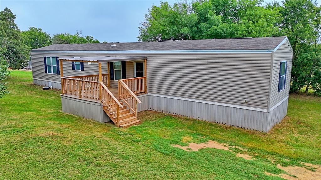 Beautifully updated 3-bedroom, 2-bathroom 2019 mobile home situated on a spacious 0.594-acre lot in Nocona, offering privacy and plenty of room to grow. This move-in ready home features central heat and air along with numerous recent renovations, including fresh interior paint, new carpet, updated countertops, new bathroom vanity, new sinks, and a new kitchen faucet. The current owners have also added inviting front and back porches, creating the perfect spaces to relax and enjoy outdoor living. The large lot provides extra privacy while still being conveniently located less than five blocks from Nocona High School and only six blocks from downtown Nocona. Whether you’re searching for a starter home, investment property, or simply a place to enjoy small-town living with extra space, this property offers a great opportunity in Nocona, Texas!