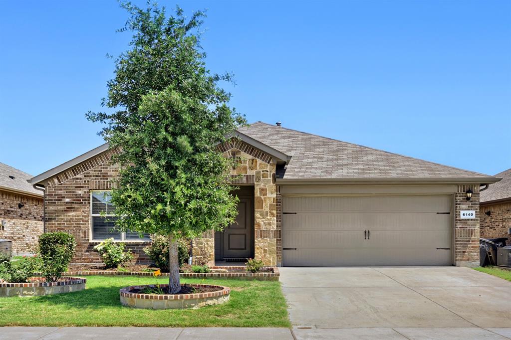 Welcome to this beautifully maintained 4-bedroom, 2-bath home featuring an open-concept design perfect for both everyday living and entertaining. The spacious living area flows seamlessly into the chef-inspired kitchen, complete with granite countertops, a large seating island, gas range, built-in microwave, and walk-in pantry. The split-bedroom floorplan offers privacy, with the primary suite tucked away at the back of the home and featuring dual sinks, an oversized walk-in shower, and a generous walk-in closet.

Additional features include a 2-car garage, tile flooring in the entry, hallways, and wet areas, smart home technology, and abundant natural light throughout. Step outside to enjoy the private fenced backyard with a sprinkler system and plenty of room for outdoor gatherings.

Residents enjoy access to community amenities including a pool, playground, splash pad, picnic areas, and scenic green spaces. Conveniently located near Eagle Mountain Lake, major highways, shopping, dining, entertainment, and just minutes from DFW Airport and downtown Fort Worth. Located within the highly regarded Eagle Mountain-Saginaw ISD.
