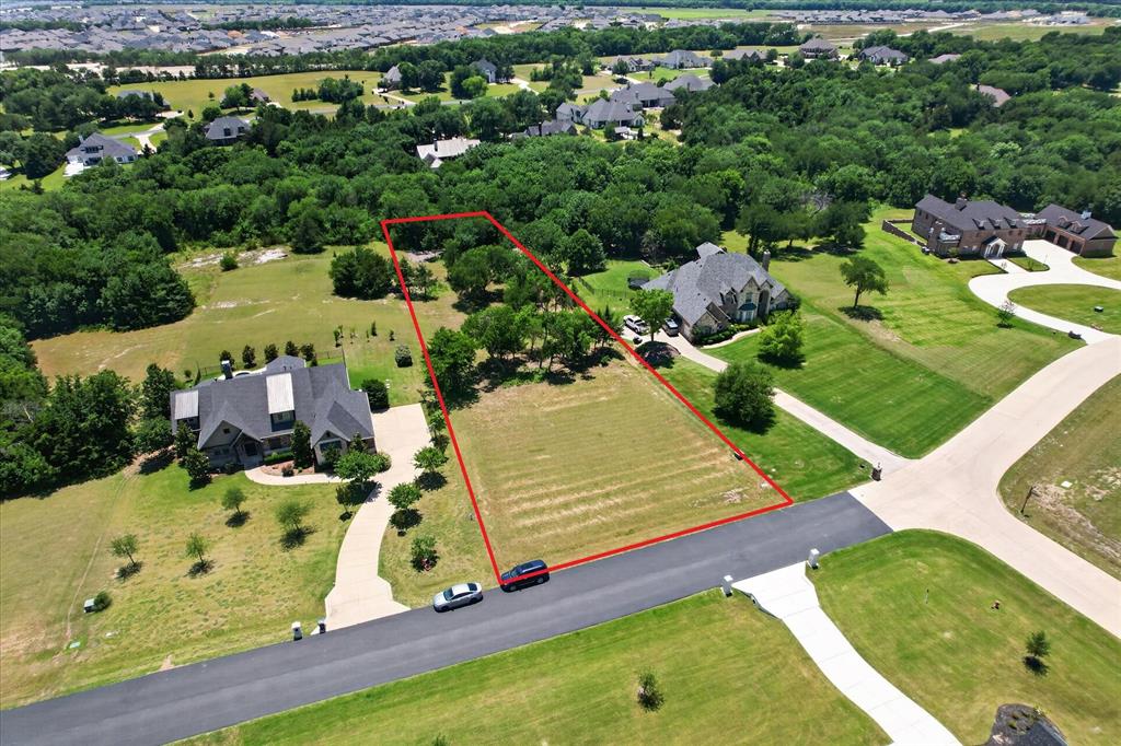 Excellent 1.11 acre lot in the highly soughted gated community of Waterstone Estates. This lot offers trees at the back half of the property and cleared at the front to allow for an easier build job for your dream home. The neighborhood has 4 lakes, ponds, a private fishing pier, lakeside park, soccer field, picnic pavilion, and basketball court. The lot is less than 10 miles to Downtown McKinney, with conveniences to all of the attractions in the metroplex