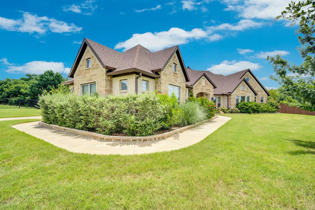 BETTER THAN NEW, CUSTOM BUILT by AGC Custom Homes.  Welcome to this TOTALLY DIALED MASTERPIECE in the highly sought-after Mockingbird Estates community of Midlothian! From the moment you step inside, you'll be captivated by the open-concept design featuring soaring ceilings, abundant natural light, and beautiful hardwood flooring throughout. The gourmet kitchen is a chef’s dream, boasting granite countertops, stainless steel appliances, ample cabinetry, and seamless flow into the dining area—perfect for everyday living and entertaining alike. The spacious living room serves as the heart of the home, offering a cozy fireplace and plenty of room to gather with family and friends.  Retreat to the private owner’s suite, a true sanctuary featuring a spa-like ensuite bath with dual vanities, a relaxing soaking tub, and a separate walk-in shower.  Step outside and discover your own backyard paradise. Designed for year-round enjoyment, the outdoor living space features a sparkling pool, relaxing spa, and an extended covered patio that provides the perfect setting for outdoor dining, entertaining, or simply unwinding after a long day in front of the relaxing fireplace. The expansive backyard offers plenty of space for recreation, pets, and family fun while creating the ultimate private retreat.  Experience Texas living at its finest with resort-style amenities right in your own backyard!