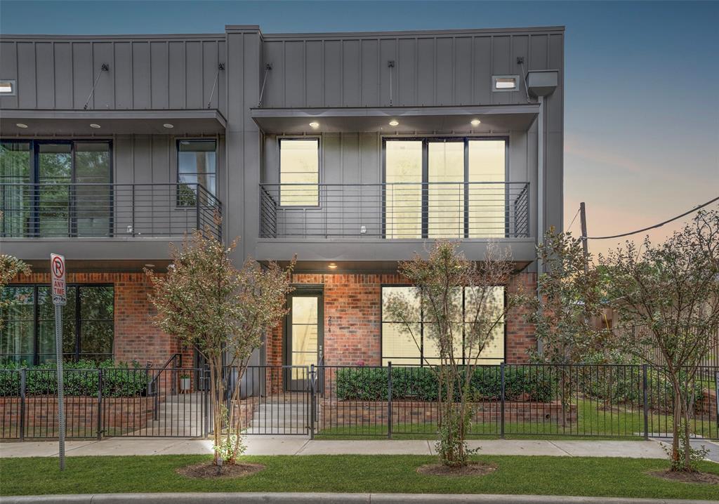 Modern residence featuring architectural flair with metal and brick exterior, an inviting front balcony and treetop views. Open floor plan is accentuated by large windows, tall ceilings, clean lines and contemporary design. Other features include hardwood floors, large island kitchen with white quartz countertops, Bosch appliances, and stainless refrigerator. Corner end-unit location with private fenced yard and 2 car garage. Conveniently located just blocks from Bishop Arts District and across from Dallas Streetcar Line providing complimentary transportation to Bishop Arts, Methodist Hospital and Downtown Dallas.