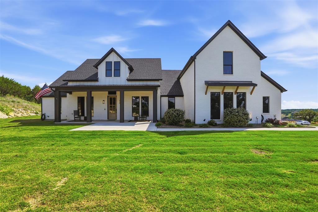 Set on one of the highest points in Eagles Bluff, 1000 Sweeney Way feels less like a home and more like a private hilltop retreat. Custom-built in July 2023, this 5-bedroom, 4.5-bath home offers 3,512 sq ft of living space, a 915 sq ft 3-car garage, and a setting designed for wide-open views, quiet mornings, sunset evenings, and room to actually live.
Inside, the home is bright, clean, and elevated without feeling overdone. The open living area centers around a statement fireplace and flows into a modern kitchen with an oversized island, generous cabinetry, and easy connection to the dining and outdoor spaces. The dining room includes a large nook and can easily shift into a private office, while the game room includes a full bath and closet, making it a flexible space for guests, media, work, or play.
Outside is where the property really separates itself. The new 40x16 high-end pool creates a true backyard destination, paired with a covered patio featuring an outdoor bar and sink for effortless entertaining. Beyond the pool, the wooded backyard feels like your own private park, with a hiking trail leading to an observation deck on the top acre where sunset views stretch across the community.
The property also includes a new 2,100 sq ft shop with loft views and a separate culvert entrance, giving you serious space for hobbies, storage, equipment, or future customization. A trampoline area, corner lot position, septic and well service, and potential for a future guest house on the Sweeney Way hilltop add even more flexibility.
Private, scenic, and thoughtfully built, this is the kind of property that gives you space, views, function, and a daily lifestyle that feels hard to find this close to Weatherford.