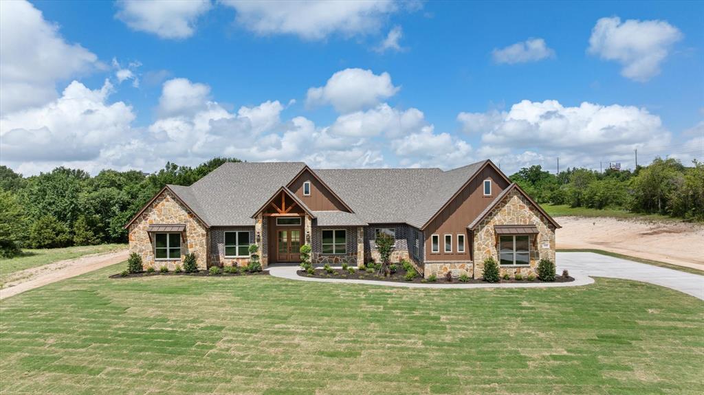 Absolutely breathtaking NEW BUILD custom home built by Rock Ridge Homes in sought after Putteet Hill between Granbury and Cresson.  This new home is 4 bedroom, 3.5 baths, open concept, with formal office, added bonus room which is a gameroom with entry door off the oversized back porch, a walk in pantry and make ready prep area, the laundry room is amazing, with sink, room for full size Washer, Dryer and space for freezer.  Primary Bedroom is ensuite and away from other 3 bedrooms for privacy, and the ensuite has a garden tub in the shower enclosure with a large area for shower.  Home sits on 4.1 acres, is landscaped around the home, has a sprinkler system around the home, gutters, 3 car garage,  and sits at the end of a cul-de-sac for added privacy.  The living area has a rock fireplace with gas logs, large islands is the center piece of the kitchen for entertaining and the kitchen has an industrial 6 burner gas range, stove, oven and warmer,  walk in pantry, with a prep area overlooking the back yard which would make a great wet bar area.  Home has so many builders extras and well thought out.  Check out the stained cabinets, the detail in all the bathrooms, from granite, to tile and backsplash.  Puteet Hill is on the Ft Worth side of Granbury making it easy to commute to metroplex for work, shopping or playing.