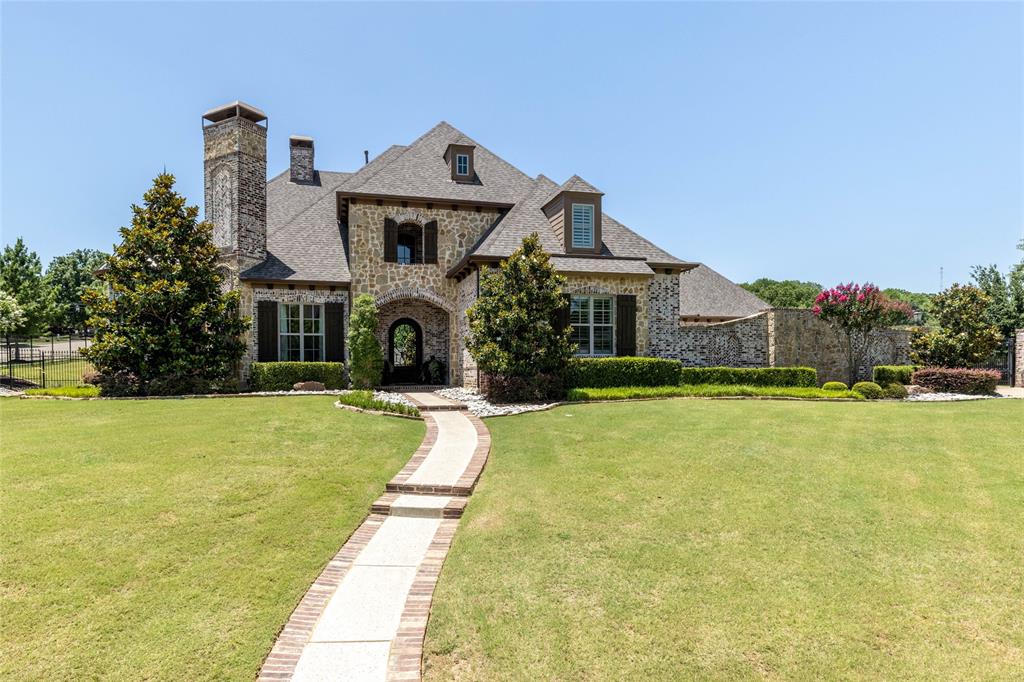 This is the one you've been waiting for! North Keller estate in The Manors of Waterford located on 1.098 acres of pure beauty! All bedrooms are oversized with En Suite baths. First floor Guest Suite has handicap accessible, oversized doors. The beautifully flowing, open floor plan is perfect for entertaining. The breathtaking kitchen features two exquisite granite islands, breakfast bar, copper farm sink, built-in stainless Thermador refrigerator, KitchenAid 6-burner gas cooktop, double oven, warming drawer, two touch faucets, coffee bar, Butler's pantry and wood beamed ceiling. Luxury amenities include stunning iron front door, hand scraped hardwood flooring, solid wood doors throughout, large private study, 3 fireplaces, pre-wired for security cameras, sound speakers & intercom, Outdoor Living Center, Pet Room off laundry, oversized driveway with large motorcourt and engineered wing wall, 5 oversized garages and driveway privacy auto-iron gate. You'll love coming home!