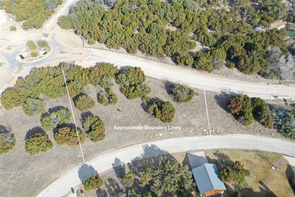Beautiful, treed lot within the amenity rich Harbor community. Build inside Possum Kingdoms most prestigious development or a great lot to purchase as a membership for access to all of the resort style amenities the Harbor offers. Walking distance to large fishing pond, main resort pool, and the fitness center! The Harbor boasts an array of upscale amenities that can be used year round. HOUSE PLANS AVAILABLE FOR PURCHASE!