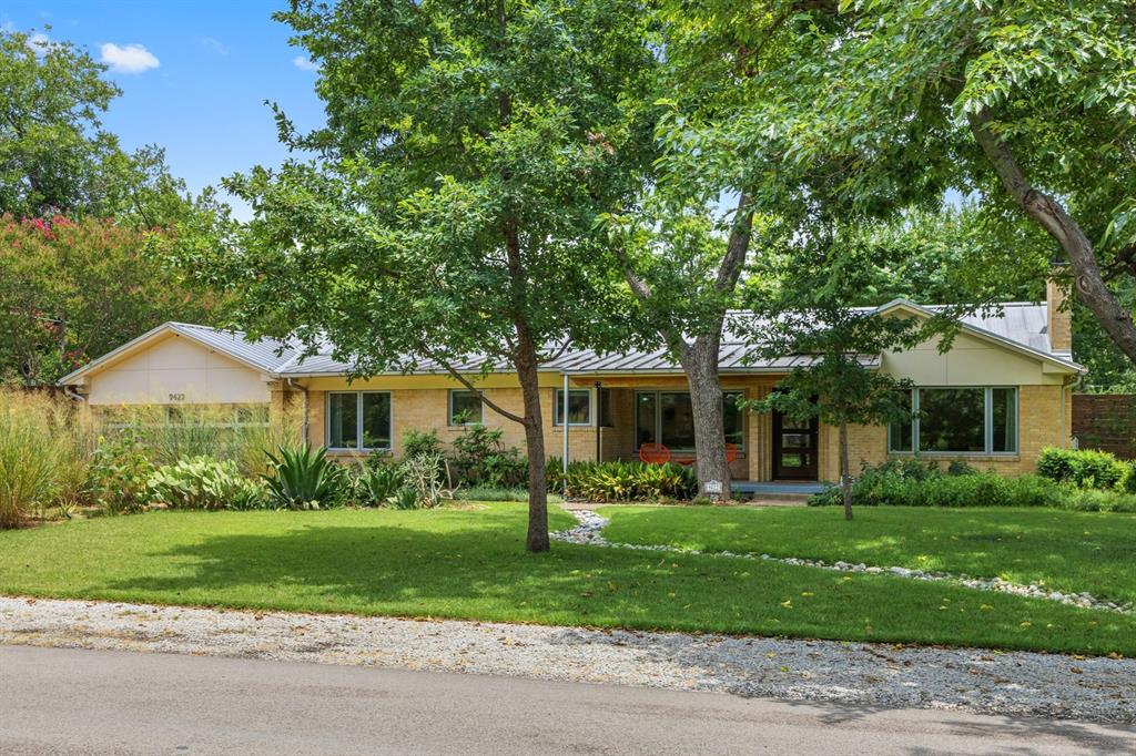 Beautifully updated and meticulously maintained, this sophisticated 3-bedroom, 2.5-bath home in coveted Casa Linda Estates blends timeless elegance with modern design. The open-concept floor plan features museum-finish walls, abundant natural light, and a stunning custom kitchen. The luxurious primary suite offers soaring ceilings, clerestory windows, a sitting area, and a spacious walk-in closet. Two additional bedrooms and a versatile lounge room provide flexible space for family, guests, a home office, or media room. Situated on over half an acre, the property boasts a lush lawn, mature trees, a fully powered and air-conditioned workshop, and a charming greenhouse. A standing seam metal roof with owned solar panels adds both style and energy efficiency. Just minutes from White Rock Lake and the Dallas Arboretum, enjoy miles of scenic biking and walking trails, plus convenient access to shopping, dining, and the library. This exceptional property offers the perfect blend of luxury, functionality, and an unbeatable East Dallas lifestyle.