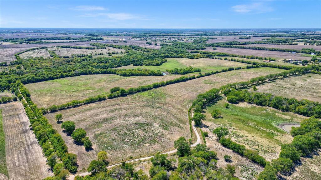 Gently sloping ranch in a good location of active development and pre development tracts.  This ESTATE sale has a private road dividing the tract with land on the north and south side. Has public water that stops at the entrance to the tract and has GCEC electric along the private road. There is a small creek and nice views of the countryside.