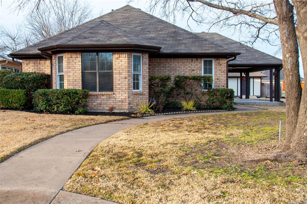 Three-bedroom, two-bath home situated on a corner double lot with alley access to the garage. An additional concrete driveway provides ample space for RV parking. The living room features a cozy gas log fireplace along with updated lighting in the living room, dining area, and kitchen. The kitchen and both full bathrooms are finished with granite countertops. A versatile bonus room is ideal for a home office or playroom. The detached building offers endless possibilities to fit your needs and imagination.